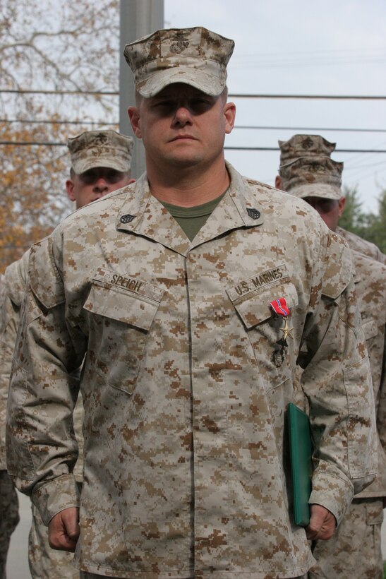 051202-M-7082F-001 CAMP PENDLETON, Calif. -- Staff Sgt. Anthony B. Speich stands at attention after being awarded the Bronze Star with "V" Device during a ceremony here Dec. 2. Speich earned the medal for his actions in Afghanistan on April 24, 2005 which resulted in the degraded ability of enemy forces and saved the lives of numerous coalition soldiers. Speich was serving as a combat advisor and patrol leader with Special Forces Operational Detachment, Company C., 1st Battallion, 7th Special Forces Group, Combined-Joint Special Operations Task Force Afghanistan. (Official U.S. Marine Corps photo by Lance Cpl. Patrick J. Floto)