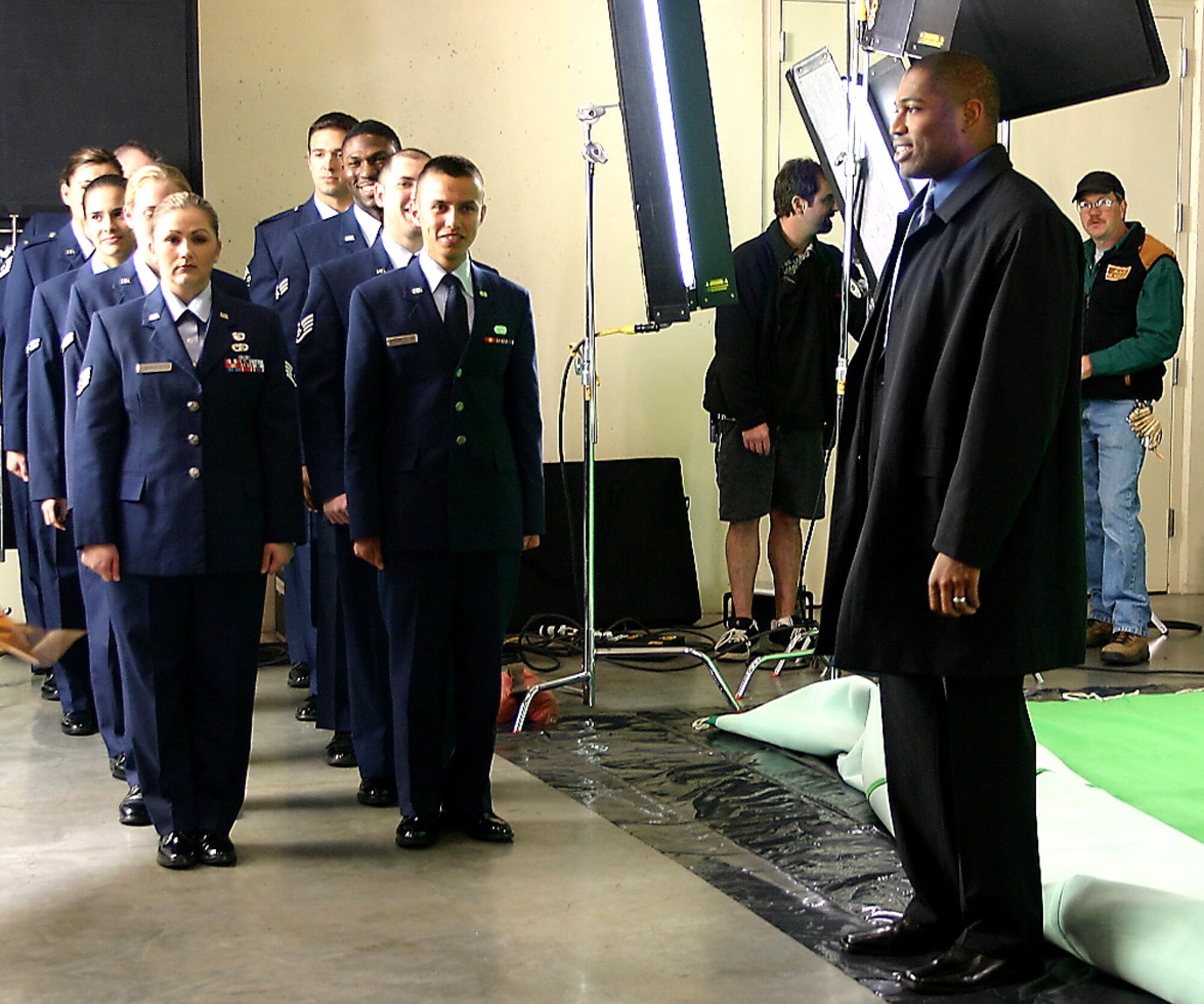 SEATTLE (AFPN) -- Airmen from McChord Air Force Base, Wash., wait for their cue to march in front of Seattle Seahawks' running back Shaun Alexander during the filming of a Monday Night Football promo Dec. 1 at Qwest Field in Seattle. (U.S. Air Force photo by Staff Sgt. Corinna Quick)
