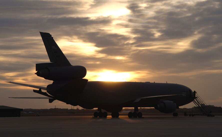 MCGUIRE AIR FORCE BASE, N.J. (AFPN) -- A KC-10A Extender aircraft parks on the flightline at sunset. The KC-10 is an advanced tanker and cargo aircraft designed to provide increased global mobility for U.S. armed forces. It can transport up to 75 people and nearly 170,000 pounds of cargo. It has three large fuel tanks that carry more than 356,000 pounds of fuel. (U.S. Air Force photo by Denise Gould)