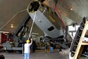 DAYTON, Ohio (10/2005) -- (From left to right) 88th Air Base Wing Engineering Equipment Operator Chris Moon and National Museum of the United States Air Force Restoration Technicians Tim Ward and Greg Hassler unload the fuselage of the B-17F &quot;Memphis Belle&quot; into the museum&#39;s restoration hangar. (U.S. Air Force photo)