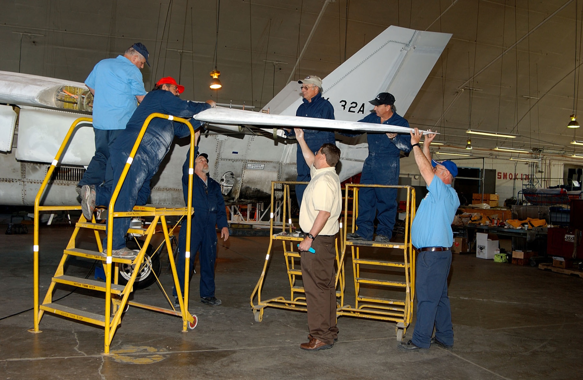 DAYTON, Ohio -- Restoration crews from Boeing and the National Museum of the United States Air Force work on the Boeing X-32A Joint Strike Fighter. (U.S. Air Force photo)