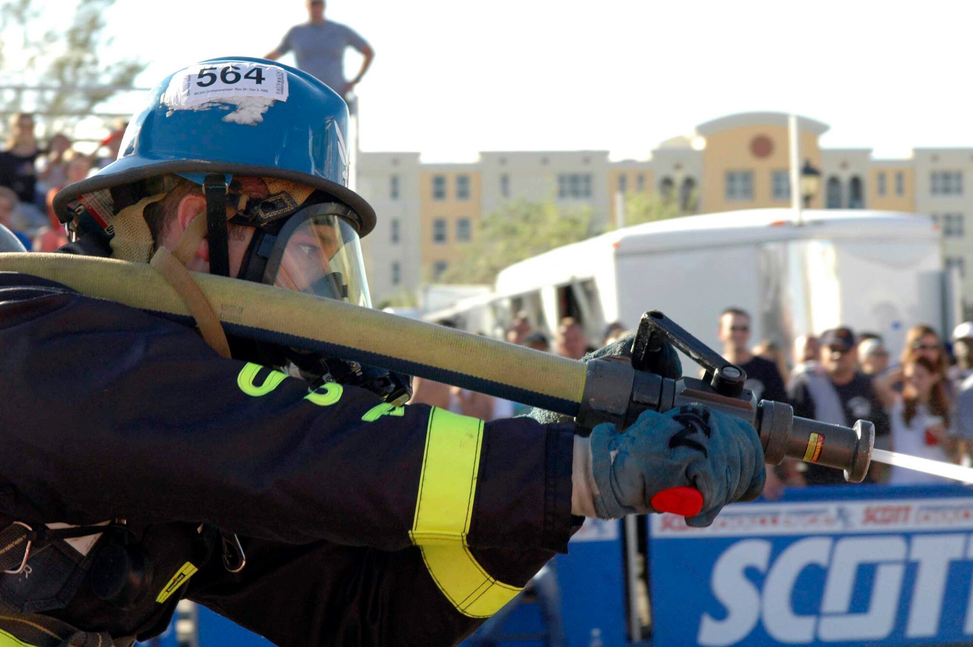 DEERFIELD BEACH, Fla. (AFPN) -- Staff Sgt. Harry Myers aims a fire hose at a target during an event at the World Firefighter Combat Challenge here. Sergeant Myers is a firefighter with the 60th Civil Engineer Squadron at Travis Air Force Base, Calif. (U.S. Air Force photo by Staff Sgt. Matt McGovern)