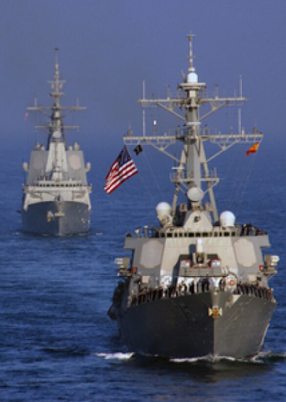 The guided-missile destroyer USS Donald Cook (DDG 75) escorts the Spanish Navy Ship Alvaro de Bazan (F101) as the Bazan concludes operations with Carrier Strike Group 2 in the Persian Gulf on Dec. 3, 2005. The Bazan was conducting maritime security operations in concert with the aircraft carrier USS Theodore Roosevelt (CVN 71) and Carrier Strike Group 2. 