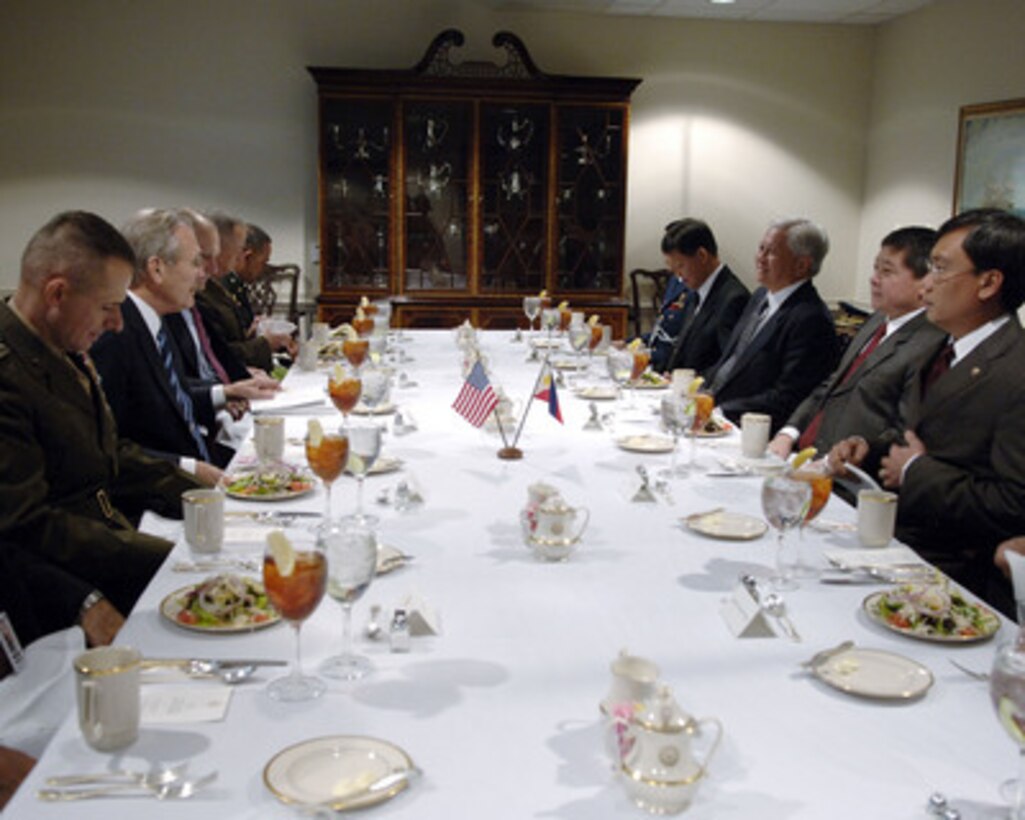 Secretary of Defense Donald H. Rumsfeld (2nd from left) hosts a working luncheon with Philippine Secretary of National Defense Avelino Cruz (2nd from right) in the Pentagon on Dec. 5, 2005. Rumsfeld, Cruz and their senior advisors will meet to discuss defense issues of mutual interest. From left to right, Chairman of the Joint Chiefs of Staff Gen. Peter Pace, U.S. Marine Corps; Rumsfeld; Under Secretary of Defense for Policy Eric Edelman; Principal Director, Asia Pacific Brig. Gen. John Allen, U.S. Marine Corps; Chief, JUSMAG Philippines Col. Mathias Velasco, U.S. Army; Philippine Defense Attaché Brig. Gen. Roberto Sylim; Under Secretary of Defense Ernesto Carolina, Philippine Ambassador to the U.S. Albert Del Rosario, Cruz, and Under Secretary of Defense Rodel Cruz. 