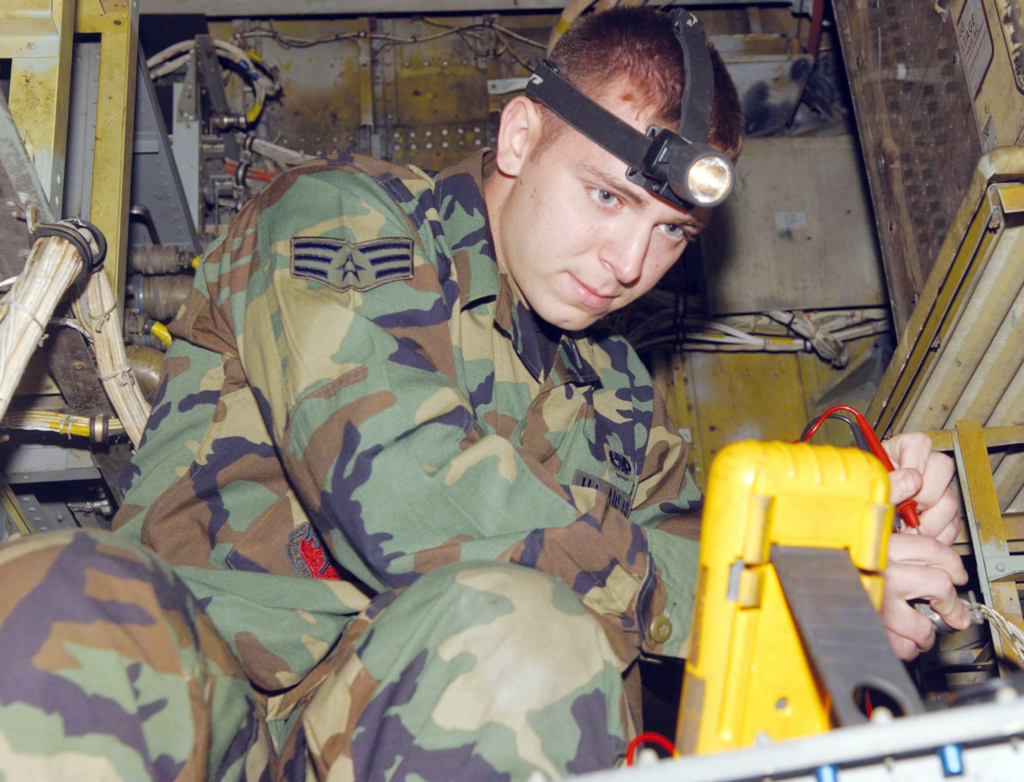 BARKSDALE AIR FORCE BASE, La. (AFPN) -- Senior Airman Antonio Caserta checks the voltage of a cannon plug. The plugs are used in aircraft air conditioning power systems. Airman Caserta is an electrical and environmental journeyman with the 2nd Aircraft Maintenance Squadron here. (U.S. Air Force photo)