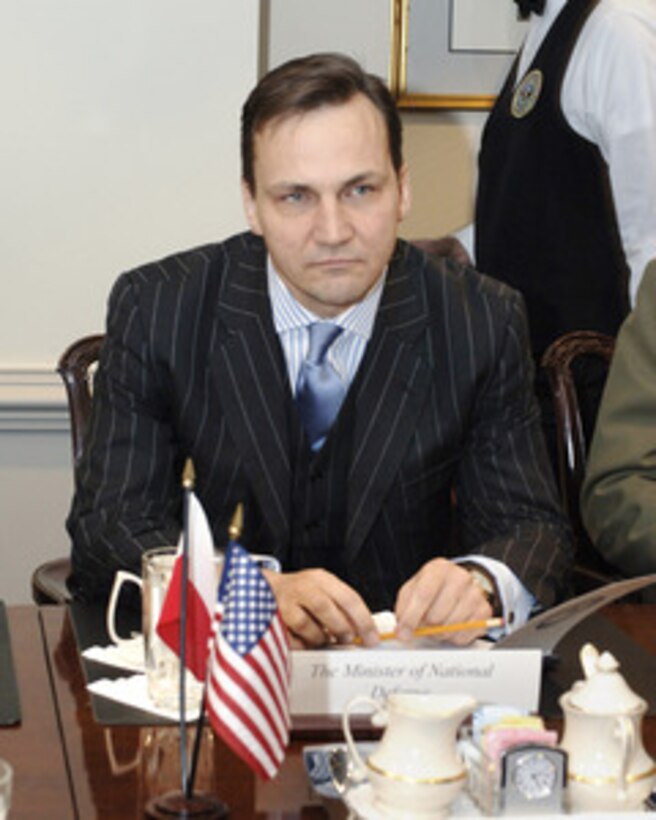 Polish Minister of National Defense Radek Sikorski meets with Secretary of Defense Donald H. Rumsfeld in the Pentagon on Dec. 7, 2005. Sikorski and Rumsfeld are meeting to discuss defense issues of mutual interest. 