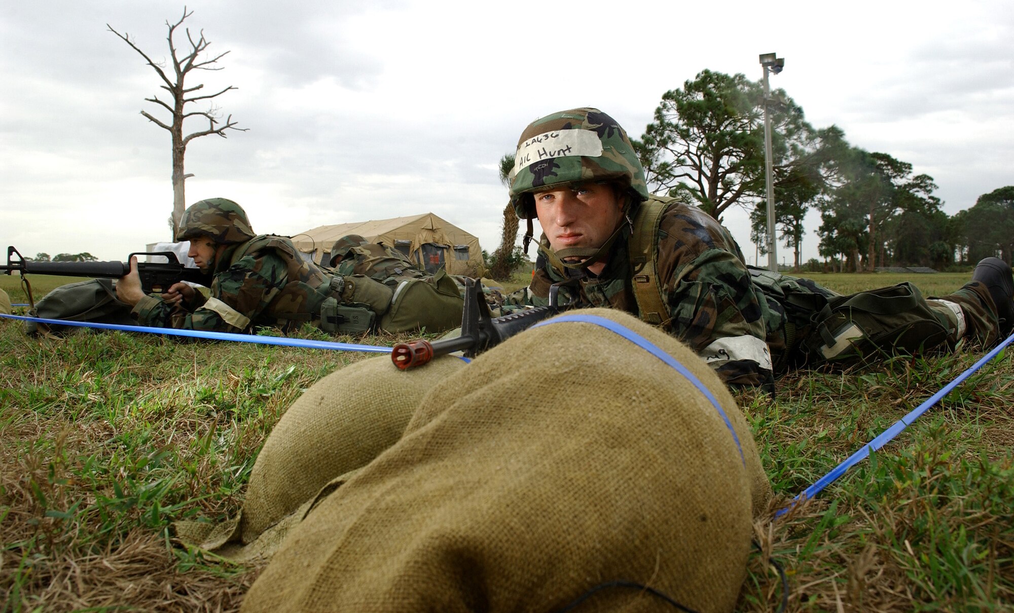 MACDILL AIR FORCE BASE, Fla. (AFPN) -- Airman 1st Class Steven Hunt and Tech. Sgt. Jason Amos guard their post during an ability to survive and operate exercise here. The exercise, held Dec. 7, trains Airman to survive and accomplish their mission under adverse combat conditions. Airman Hunt is a hazardous material storage technician with the 6th Maintenance Squadron. Sergeant Amos is a security force troop with the 6th Security Forces Squadron. (U.S. Air Force photo by Airman 1st Class Bradley A. Lail)