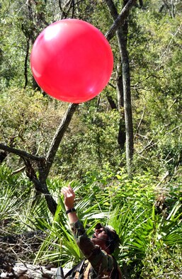 HURLBURT FIELD, Fla. - A battlefield weatherman releases a weather balloon during a special operations' weather team exercise near the base. Battlefield weathermen from the 3rd and 18th Air Support Operations Group will be realigned under the new 93rd Air Ground Operations Wing, when that unit activates at Moody in January.  (U.S. Air Force photo by Chief Master Sgt. Gary Emery) 
