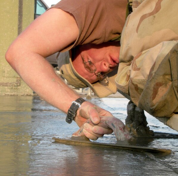 KANDAHAR AIRFIELD, Afghanistan -- Staff Sgt. Jessie Butikofer puts finishing touches on a 450-square-foot "footer" for a 50-foot high radar tower. Sergeant Butikofer is a structural journeyman with the 451st Air Expeditionary Group civil engineer flight. He is from Rexburg, Ind., and deployed from Pope Air Force Base, N.C. (U.S. Air Force photo by Tech. Sgt. Lineus Davis)