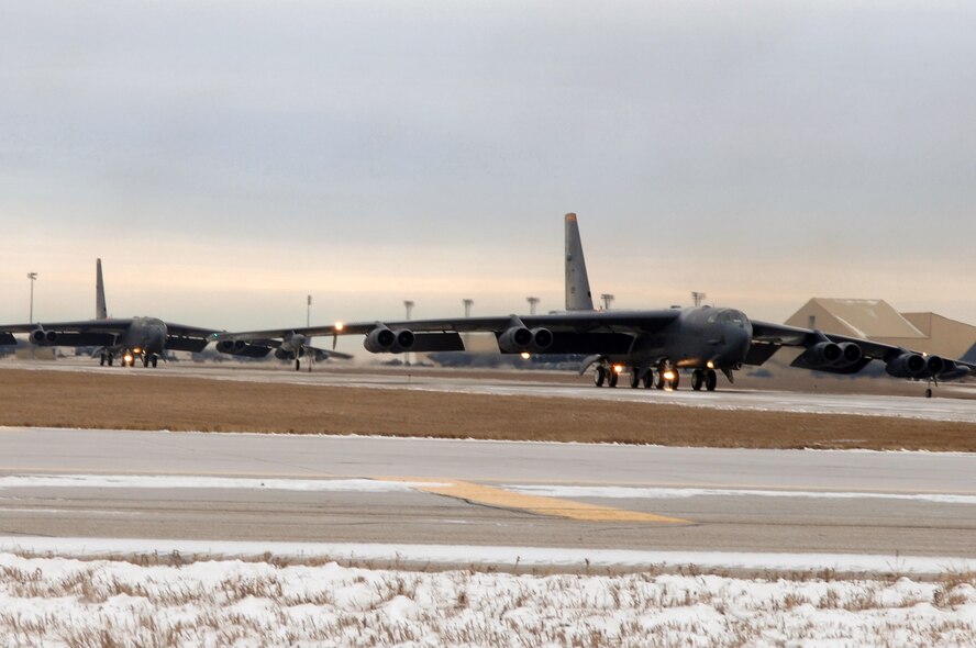 MINOT AIR FORCE BASE, N.D. (AFPN) -- B-52H Stratofortress bombers taxi before taking off for a mission. Nine of the huge bombers took part in a rapid-launch exercise Dec. 9 to test the base's ability to respond quickly to national directives. (U.S. Air Force photo by Staff Sgt. Joe Laws)