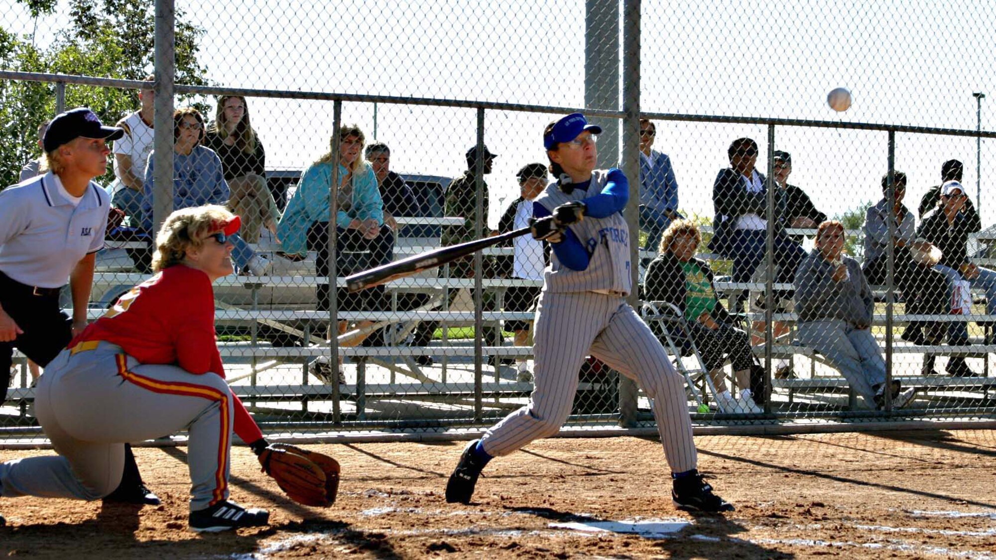 KADENA AIR BASE, Japan (AFPN) -- Staff Sgt. Twyla Sears swings at a softball during a game here. The Air Force Services Agency named Sergeant Sears the 2005 Female Athlete of the Year. The sergeant is a power production journeyman with the 353rd Operations Support Squadron. (U.S. Air Force photo)
