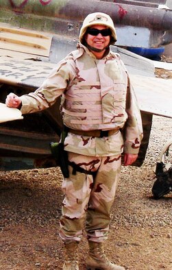 Col. Dean J. Despinoy, 507th Air Refueling Wing commander, stands in front of a MiG aircraft captured from the former Iraqi regime.  The colonel, currently deployed in support of Operation Iraqi Freedom, recently learned he has been nominated for promotion to brigadier general. Senate confirmation is still pending.  (U.S. Air Force photo)