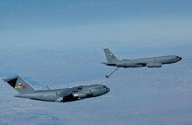 A KC-135R from the 336th Air Refueling Squadron refuels a C-17A from the 729th Airlift Squadron Dec. 6, 2005 over Arizona. Both aircraft are from the Air Force Reserve Command's 452nd Air Mobility Wing, March Air Reserve Base, Calif. (U.S. Air Force photo by Tech Sgt Rick Sforza, 4th Combat Camera Squadron)
