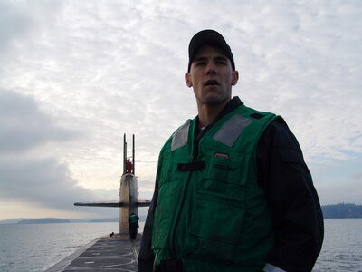 BANGOR, Wash. - Missile Technician 2nd Class Kory Faulkner takes in the view as USS Maine (SSBN 741) transits Puget Sound toward Naval Submarine Base Bangor, Wash. U.S.