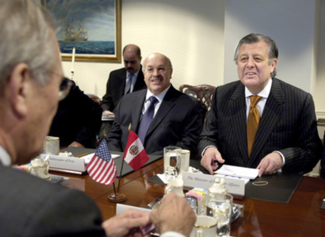 Peru's Minister of Foreign Affairs Oscar Maurtua (right) participates in security talks with Secretary of Defense Donald H. Rumsfeld (foreground) in the Pentagon on Dec. 12, 2005. Peruvian Ambassador to the United States Eduardo Ferrero (center) joined Maurtua and Rumsfeld for the talks. 