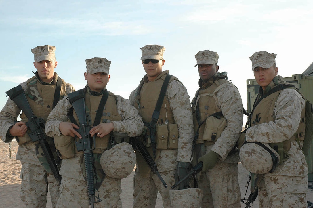 (From left to right) Sgt. Brian P. Auker, Lance Cpl. Daniel Delgado, Cpl. Richard Montgomery, Cpl. Christopher McNeal and Sgt. Brett Omara, all Marine Wing Support Squadron 274 aircraft rescue fire fighters, pose for a picture at the Cannon Air Defense Complex about five miles southeast of the air station Dec. 13. These Marines were first responders to a two-car accident while on their way to the air station Dec. 10 at the intersection of County 14th Street and Avenue 5E.