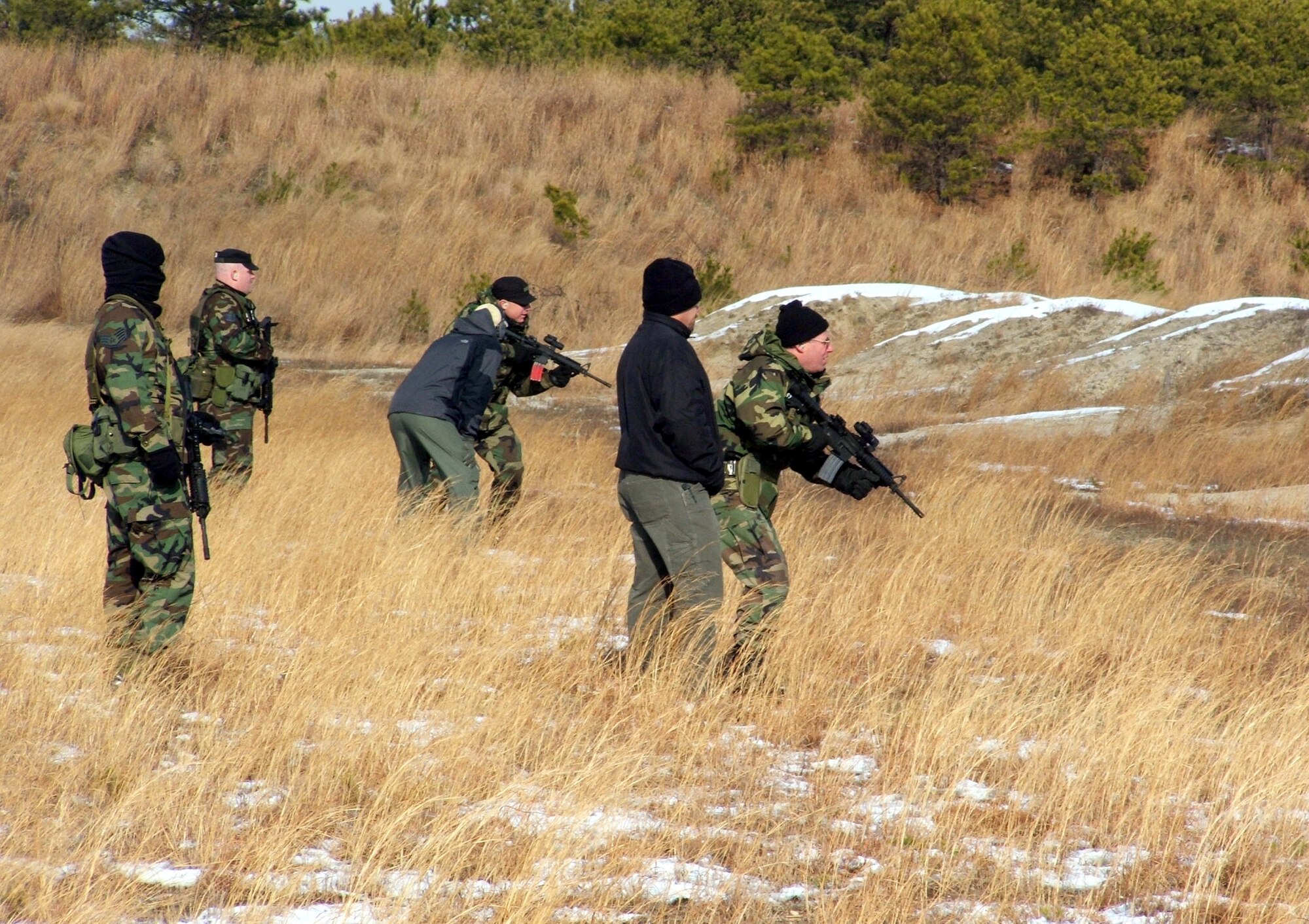 FORT DIX, N.J. (AFPN) -- Students prepare to use their M-4 rifles during a tactical live-firing exercise. The training is part of the Rules of Engagement/Rules of Use of Force Tactical Training Seminar held at the Air Mobility Warfare Center here Dec. 6 to 8. (U.S. Air Force photo by Tech. Sgt. Scott T. Sturkol)