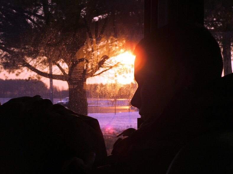 FORT DIX, N.J. (AFPN) -- An Airman checks his tactical gear at sunrise before a day on the ranges. The Airman was a student in the Rules of Engagement/Rules of Use of Force Tactical Training Seminar held at the Air Mobility Warfare Center here Dec. 6 to 8. (U.S. Air Force photo by Tech. Sgt. Scott T. Sturkol)