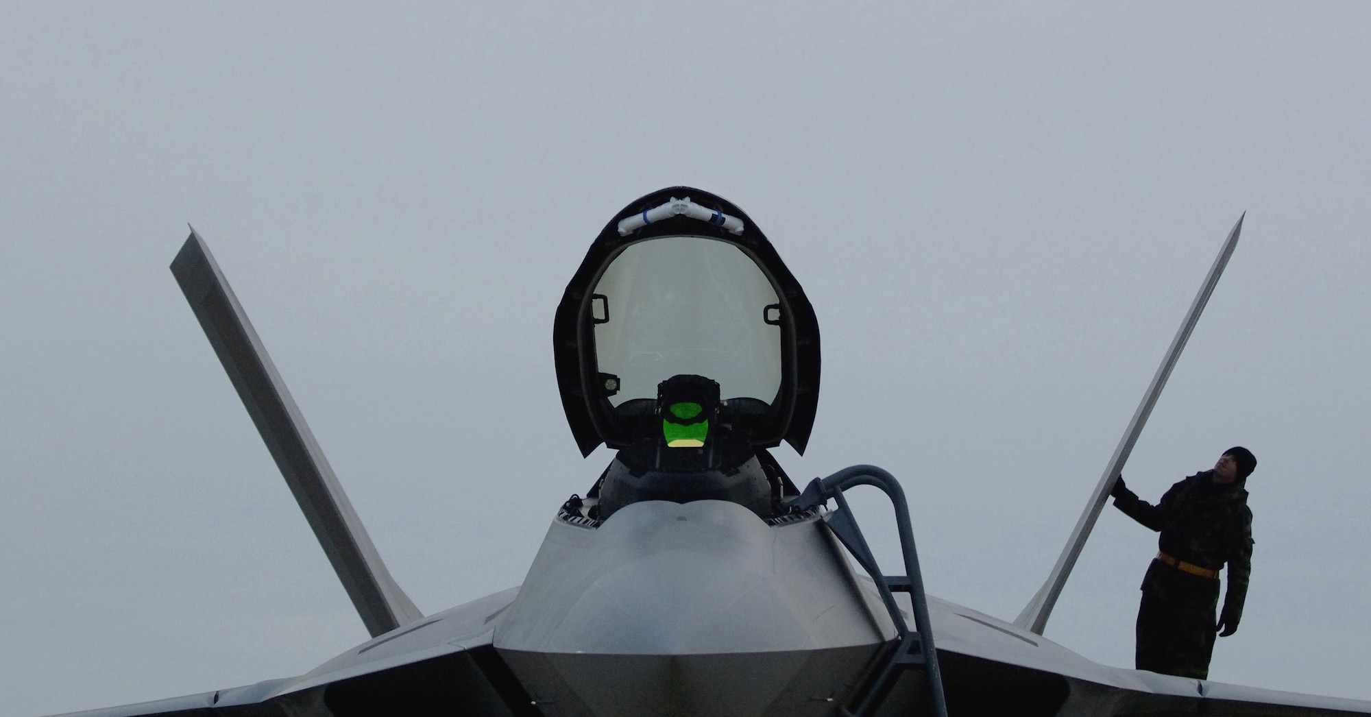 LANGLEY AIR FORCE BASE, Va. (AFPN) -- Crew chief Staff Sgt. Adam Murtishaw does a post flight inspection on an F-22A Raptor after a Dec. 14 mission. The 27th Fighter Squadron earned initial operating capability today, which means the stealth jet is combat ready. Sergeant Murtishaw is with the 27th Aircraft Maintenance Unit. (U.S. Air Force photo by Tech. Sgt. Ben Bloker)