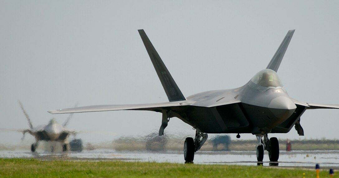 LANGLEY AIR FORCE BASE, VA. (AFPN) -- Two F-22A Raptors taxi down the runway. (U.S. Air Force photo by Tech. Sgt. Ben Bloker)