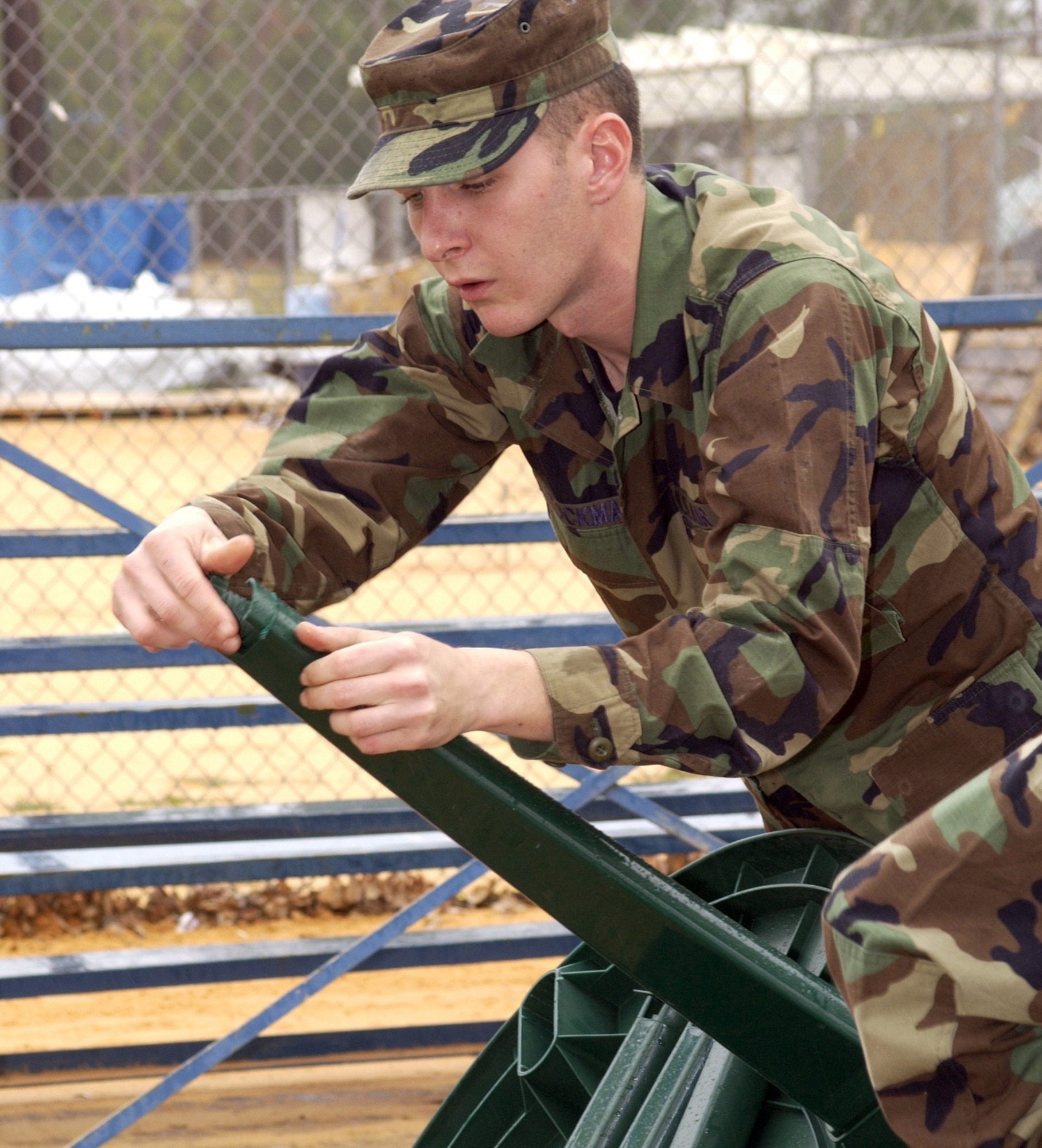 KEESLER AIR FORCE BASE, Miss. (AFPN) -- Airman Basic Kyle Stockman assembles a table at Rudy Moran Park in D'Iberville, Miss. People who lost their homes to Hurricane Katrina are living in tents at the park. Airman Stockman is with the 336th Training Squadron, (U.S. Air Force photo by Kemberly Groue)