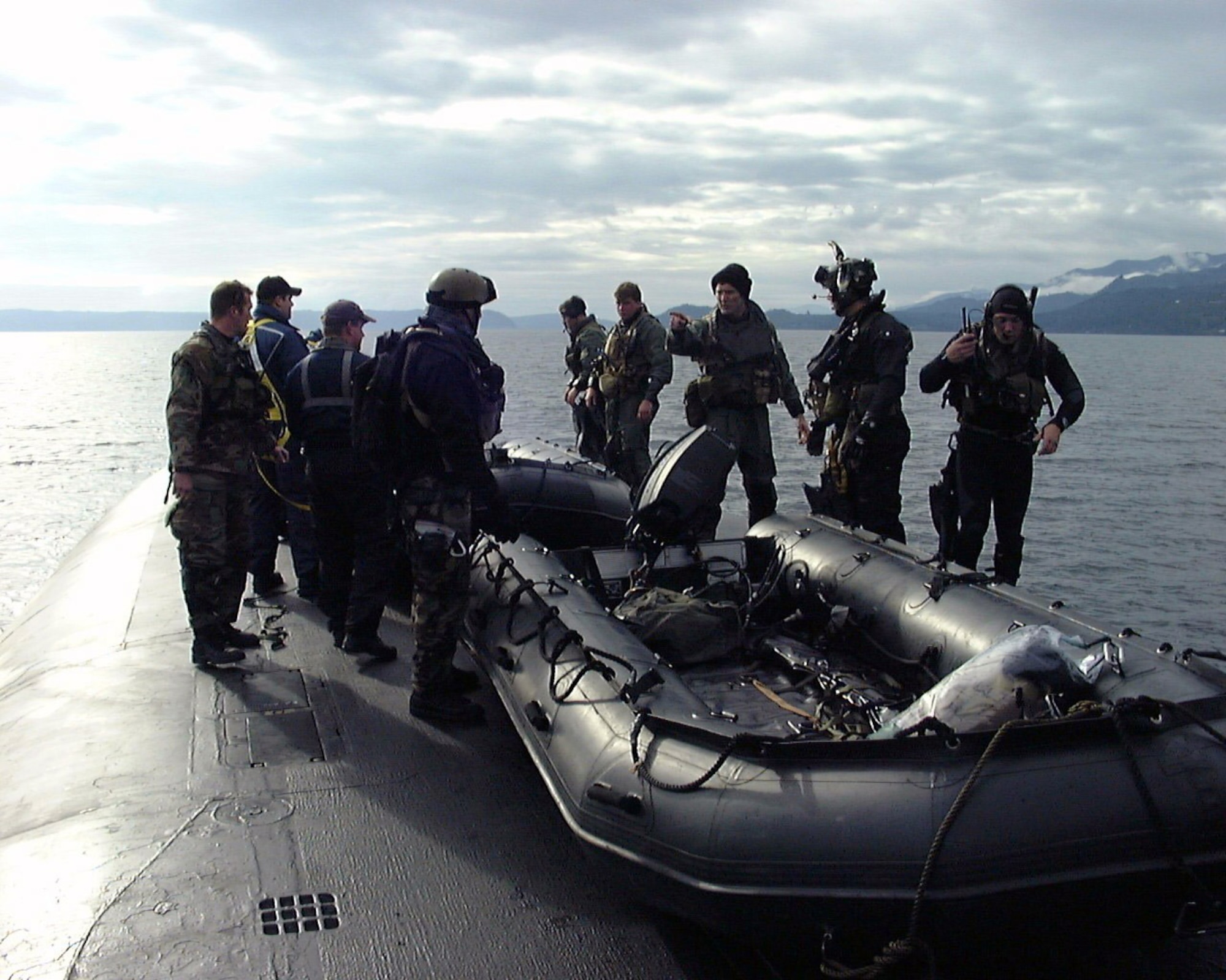 ONBOARD USS ALABAMA (AFPN) -- Airmen with the 22nd and 23rd Special Tactics squadrons launch an inflatable boat into the Pacific Ocean during an exercise. The exercise tested special operations infiltration and rescue tactics. The joint effort also tested the capabilities of the Ohio-class ballistic missile submarines, which enter service next year. The submarines are being converted from ballistic missile submarines to guided missile submarines with new capabilities. (U.S. Navy photo by Master Chief Petty Officer Daniel J. Niclas)