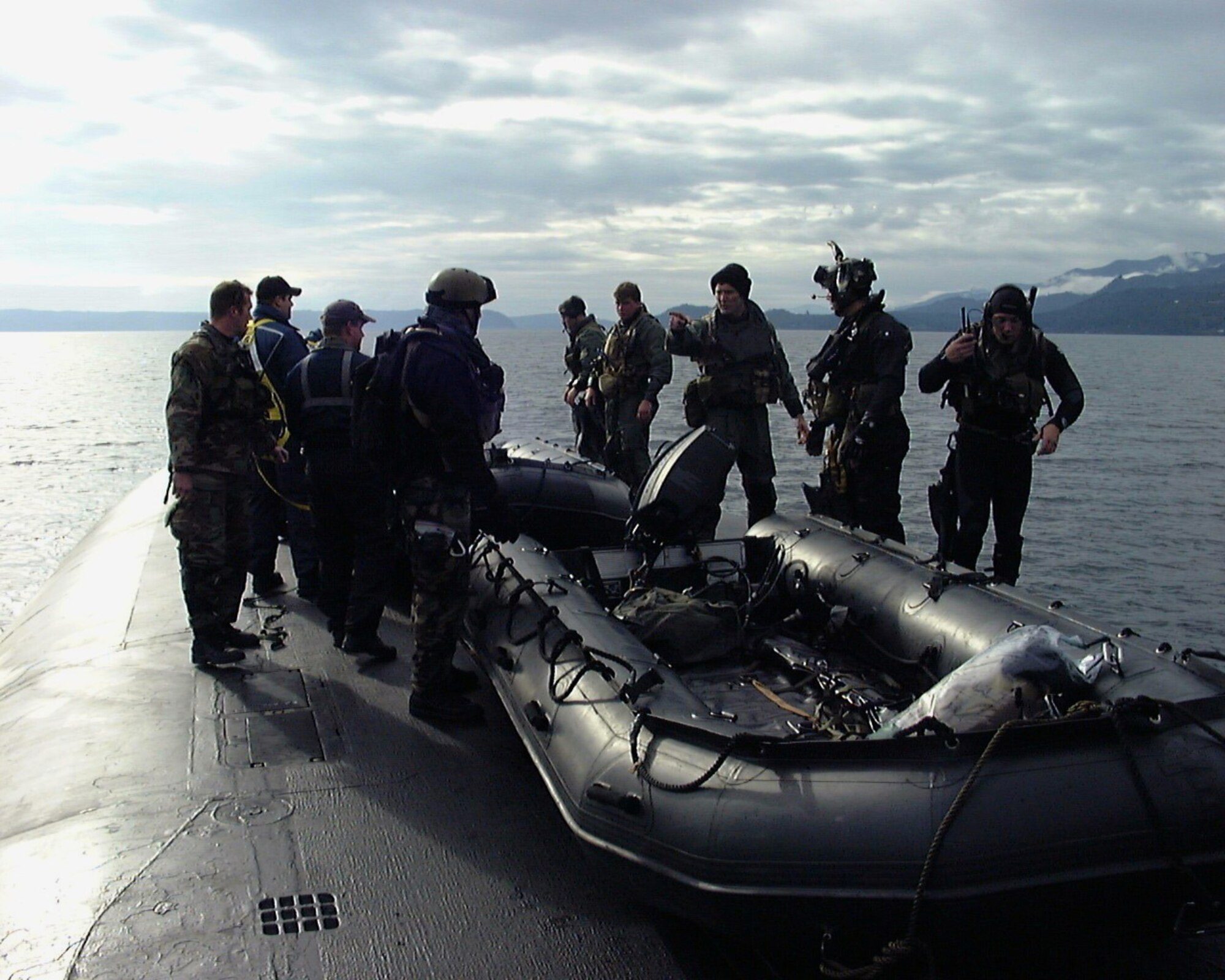 Air Force special operations forces from the 22nd and 23rd Special Tactics Squadrons prepare to launch an inflatable boat from the deck of USS Alabama (SSBN 731) in the Pacific Ocean during a recent exercise to test special operations infiltration and rescue tactics. The joint effort also tests the capabilities of the SSGN class submarines entering service next year. The SSGN class submarines are being converted from ballistic missile submarines to guided missile submarines with new capabilities.  US Navy photo by FTCM (SS) Daniel J. Niclas

