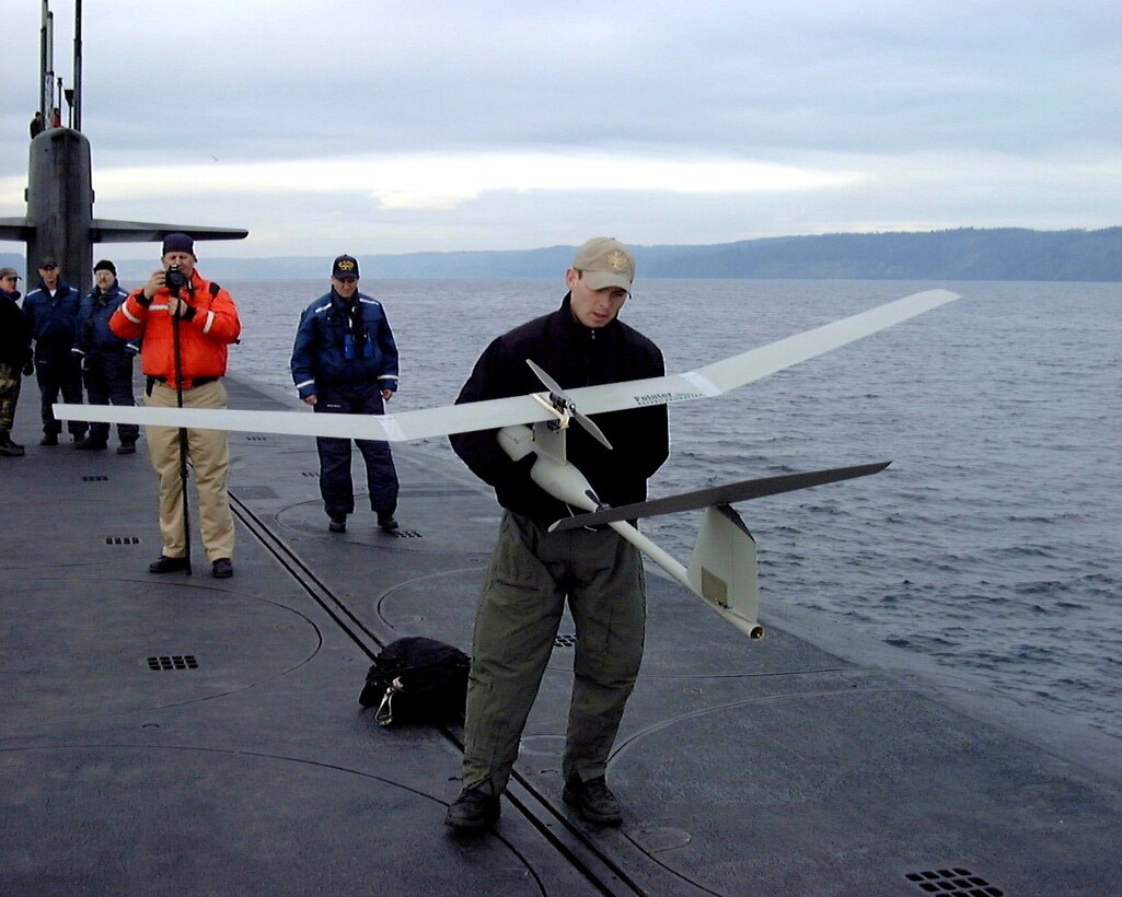 ONBOARD USS ALABAMA (AFPN) -- Airmen with the 22nd and 23rd Special Tactics squadrons launch a Pointer unmanned aerial vehicle during an exercise. The exercise tested special operations infiltration and rescue tactics. The joint effort also tested the capabilities of the Ohio-class ballistic missile submarines, which enter service next year. The submarines are being converted from ballistic missile submarines to guided missile submarines with new capabilities. (U.S. Navy photo by Master Chief Petty Officer Daniel J. Niclas)