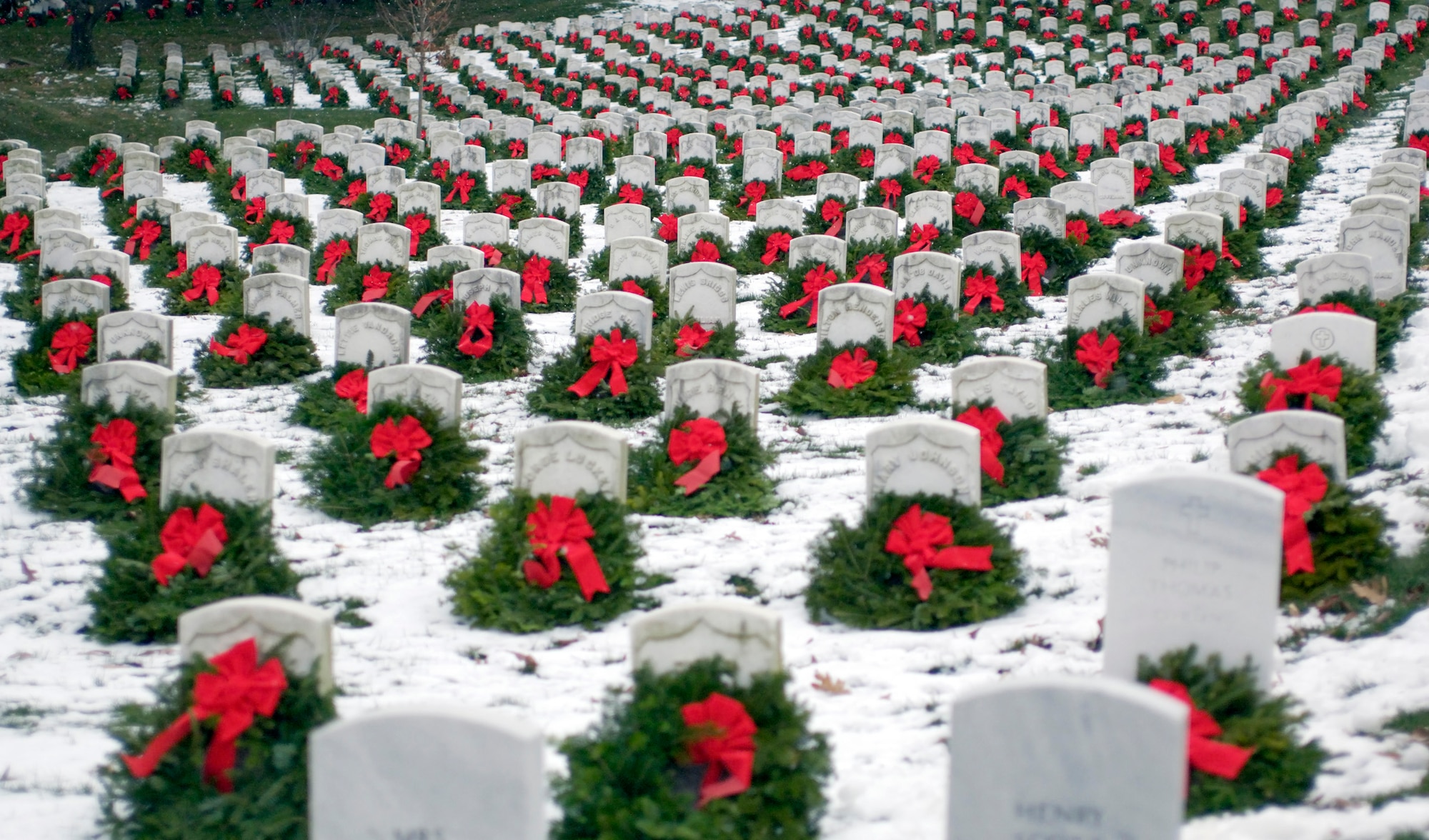 ARLINGTON, Va.-- Christmas wreaths adorn head stones at Arlington National Cemetery.  The 14th annual wreath-laying event is the result of Worcester Wreath Company's owner Morrill Worcester's childhood dream of doing something to honor those laid to rest.  (U.S. Air Force photo by Master Sgt. Jim Varhegyi)