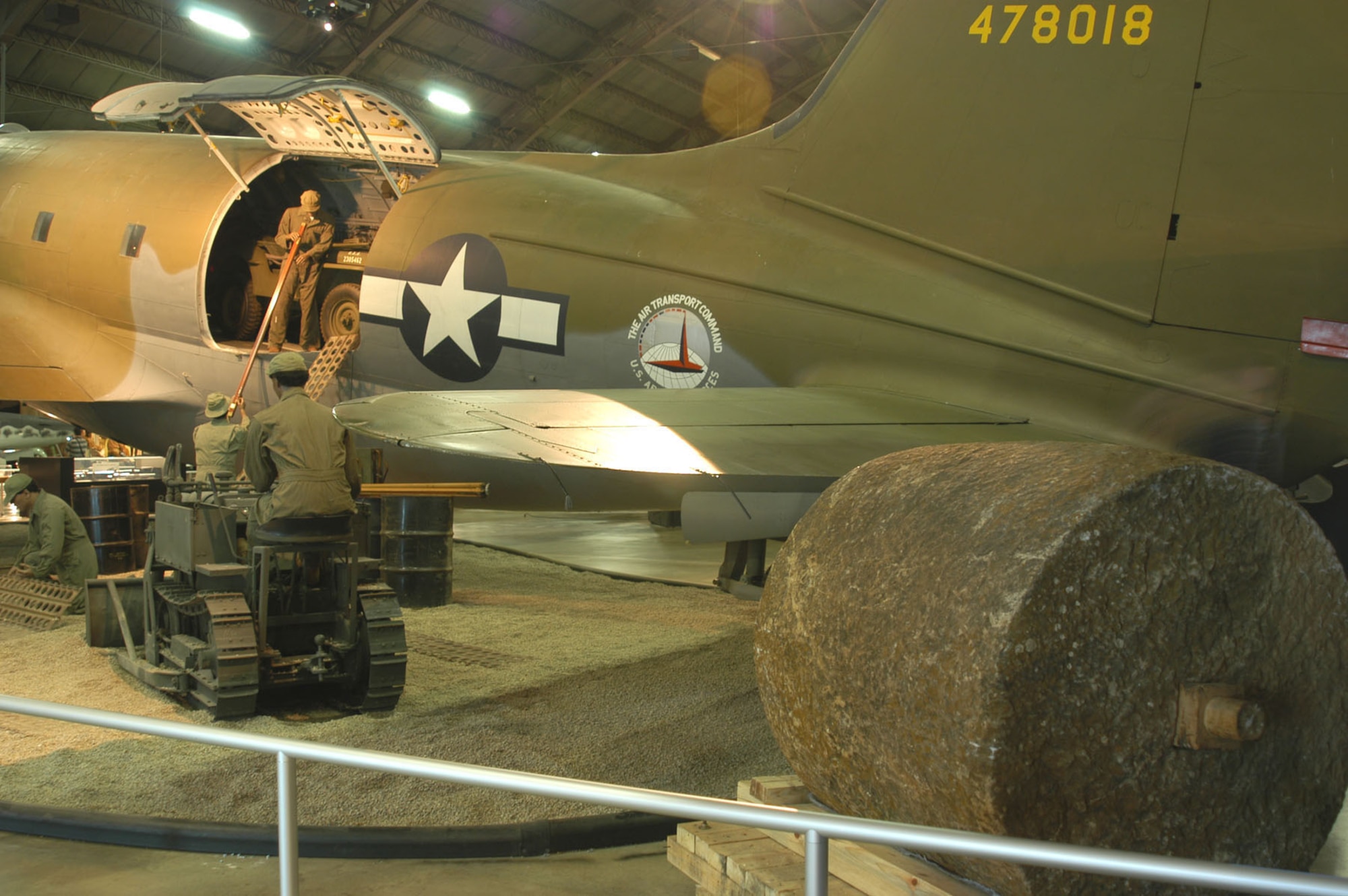 DAYTON, Ohio -- A 10,000-pound stone roller, used to compress gravel runways during World War II, is on display near the Curtiss C-46D in the World War II Gallery at the National Museum of the United States Air Force. (U.S. Air Force photo)