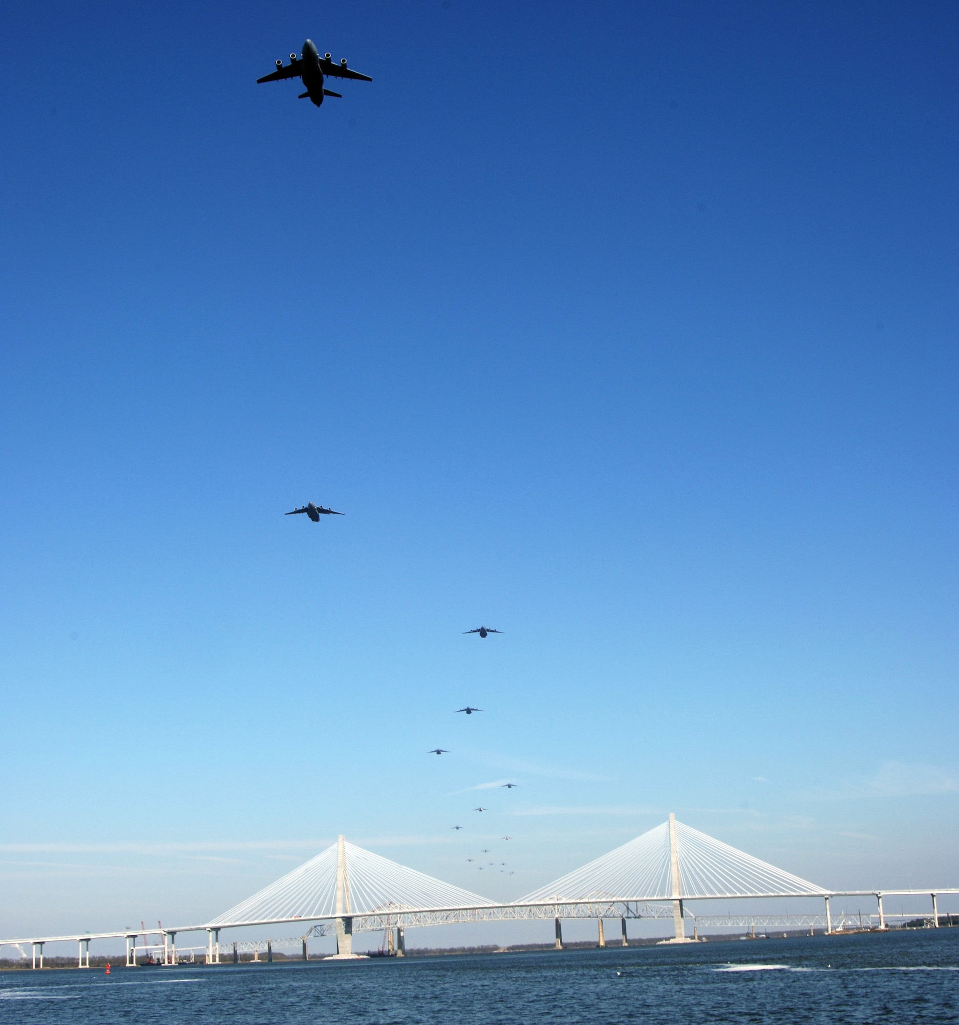 CHARLESTON, S.C. (AFPN) -- A formation of 17 C-17 Globemaster IIIs assigned to the 437th and 315th Airlift Wings at Charleston Air Force Base fly in formation today.  The flight, which demonstrates the U.S. Air Force's strategic capability, is the largest formation of C-17s to take flight from a single base.  (U.S. Air Force photo by Tech. Sgt. Richard T. Kaminsky)
