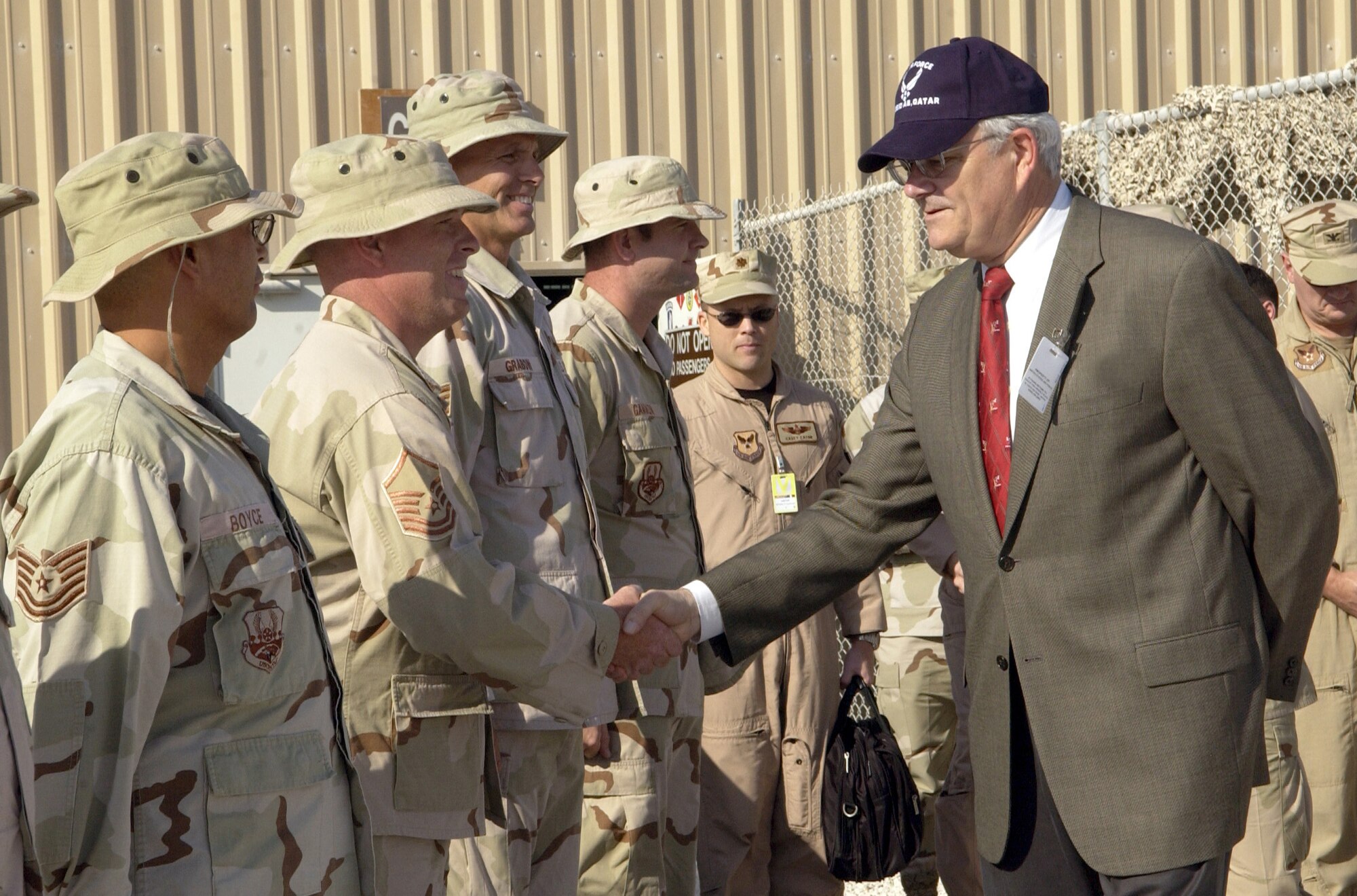 SOUTHWEST ASIA (AFPN) -- Secretary of the Air Force Michael W. Wynne shakes an Airman's hand. The Airmen are with the 379th Air Expeditionary Wing.  This is Secretary Wynne's first tour to the region.  (U.S. Air Force photo by Staff Sgt. Rhiannon Willard)