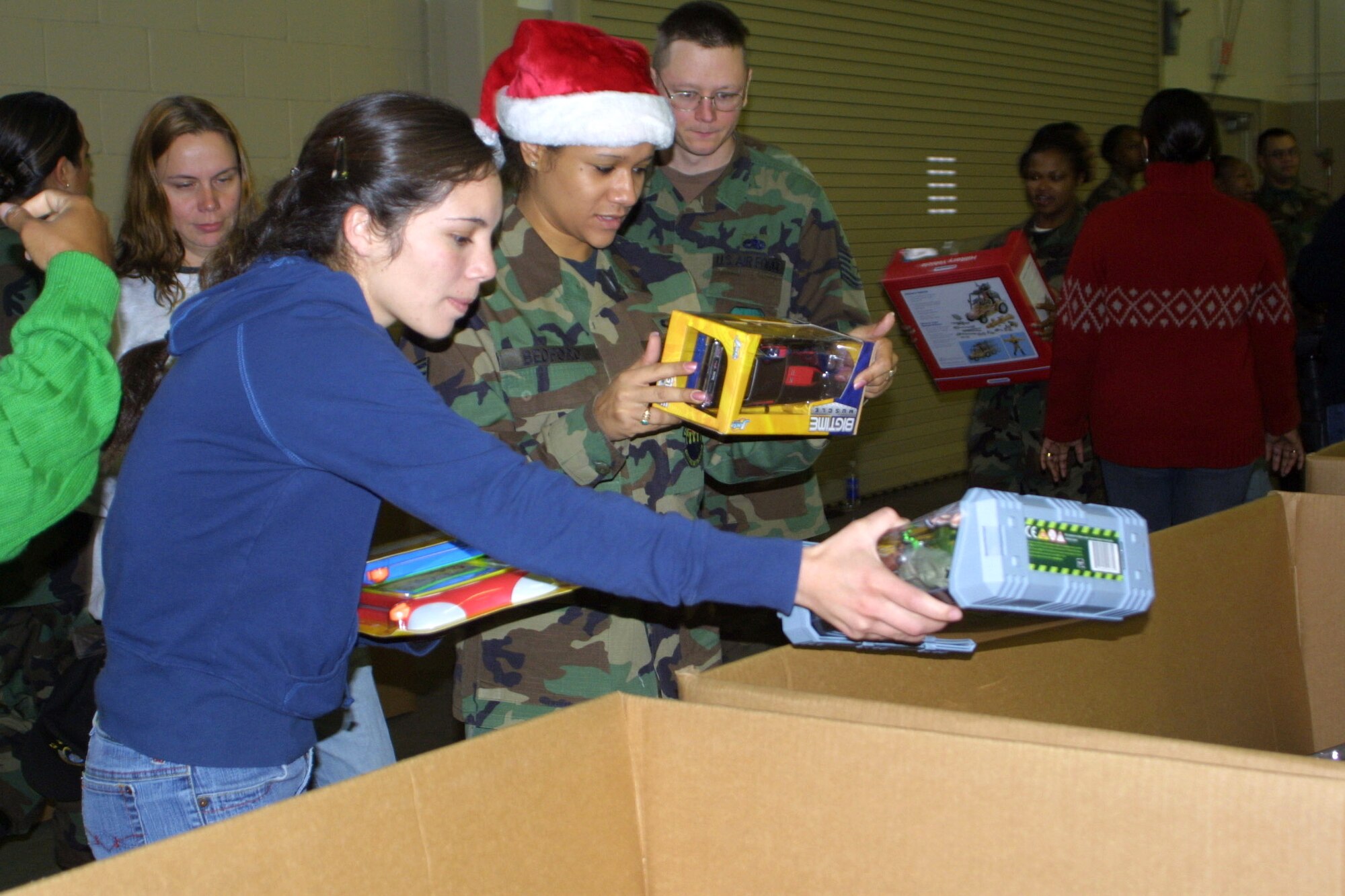 POPE AIR FORCE BASE, N.C. -- First Lt. Jamie Kelley (left) and Tech Sgt. Toyna Alston sort through toys donated to Operation Toy Drop. Sergeant Alston is with the 743rd Aircraft Maintenance Squadron, and Lieutenant Kelley is with the 43rd Mission Support Squadron. (U.S. Air Force photo by Lisa Terry McKeown)