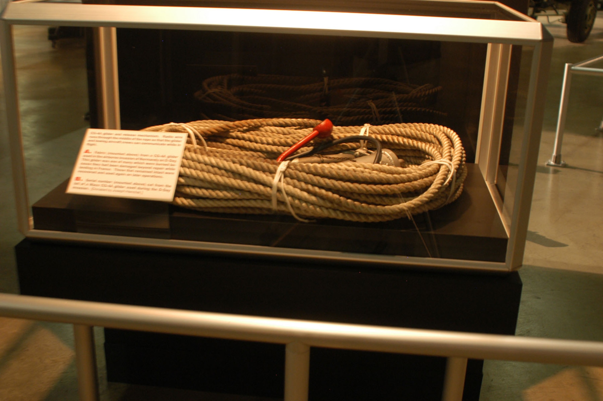 DAYTON, Ohio -- CG-4A glider and release mechanism. Radio wire runs through the middle of the rope so that the glider and towing aircraft crews can communicate while in flight. This item is on display in the World War II Gallery at the National Museum of the U.S. Air Force. (U.S. Air Force photo)