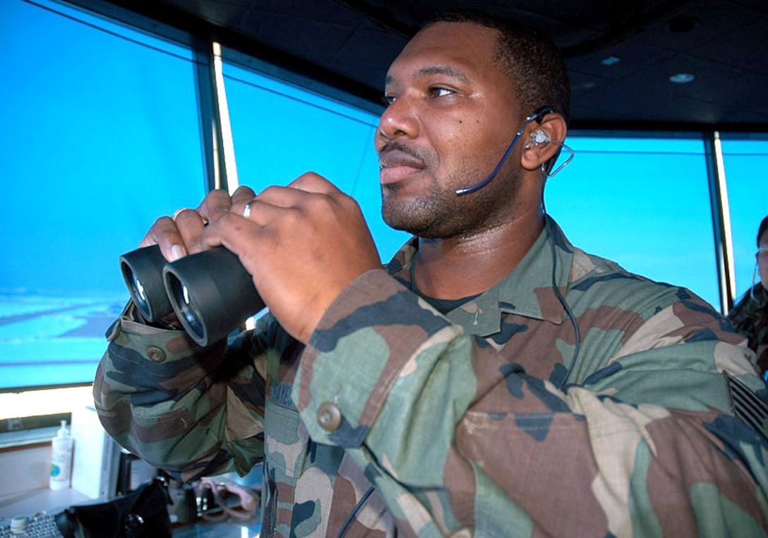 SAVANNAH, Ga., (AFPN) -- Staff Sgt. Herbert Hayes Jr. controls traffic at Kunsan Air Base, South Korea. While he was there, his family had to flee Keesler Air Force Base, Miss., before Hurricane Katrina struck. He had to return to the United States on emergency leave to help his displaced family recover. (U.S. Air Force photo by Senior Airman Brian Ferguson)