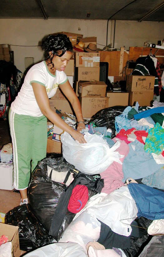 Courtney Penn, staff sergeant with the 507th Air Refueling Wing's Maintenance Squadron and vice president of the Tinker AFB Reserve Enlisted Advisory Council, sorts through donated items in preparation for the arrival of Katrina evacuees to the Oklahoma City area.