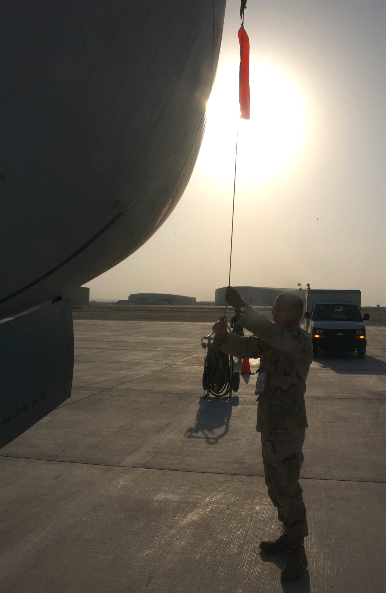 SOUTHWEST ASIA (AFPN) -- Senior Master Sgt. Mike Rumler prepares a KC-135 Stratotanker to fly a mission at this desert air base.  Sergeant Rumler is the NCO in charge of the 135 Aircraft Maintenance Unit.  He is deployed from McConnell Air Force Base, Kan.  (U.S. Air Force photo by Tech. Sgt. Mike Hammond) 
