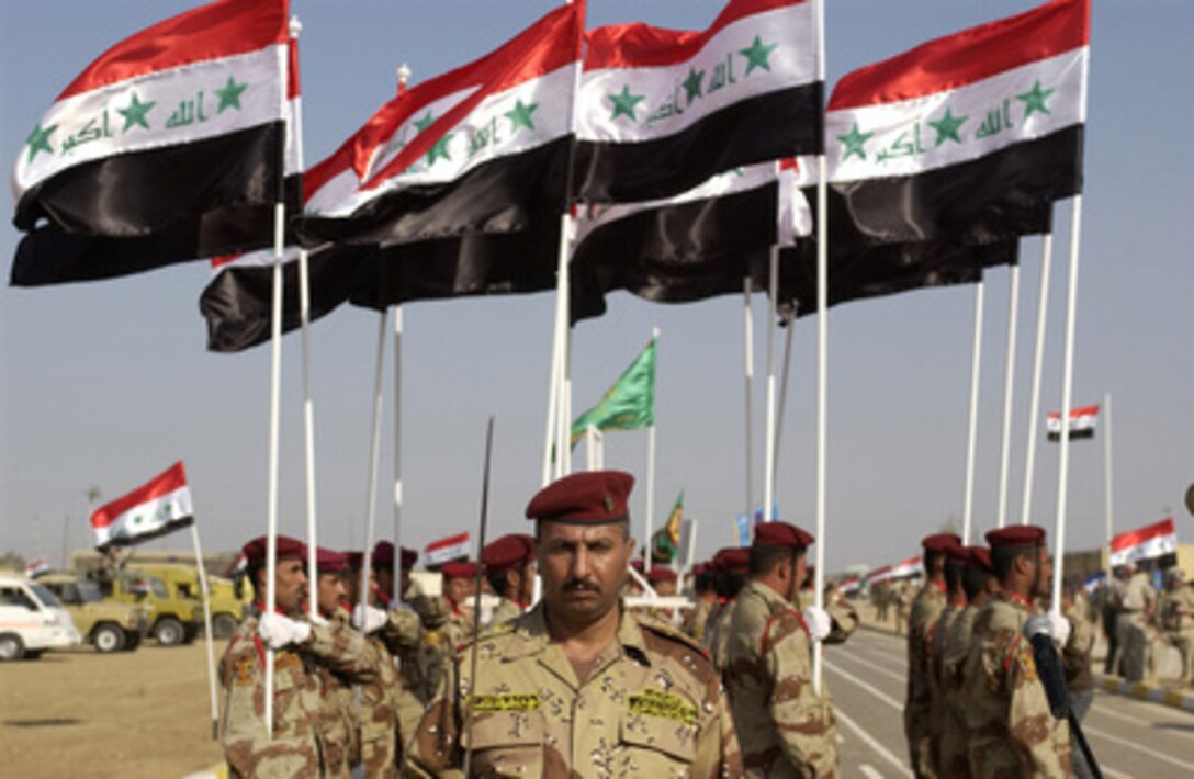 Iraqi Army 8th Division soldiers stand in formation during the certification ceremony of the 8th Division at Ad Diwaniyah, Iraq, on Dec. 20, 2005. The certification allows the Division to conduct independent operations in their area of responsibility. 