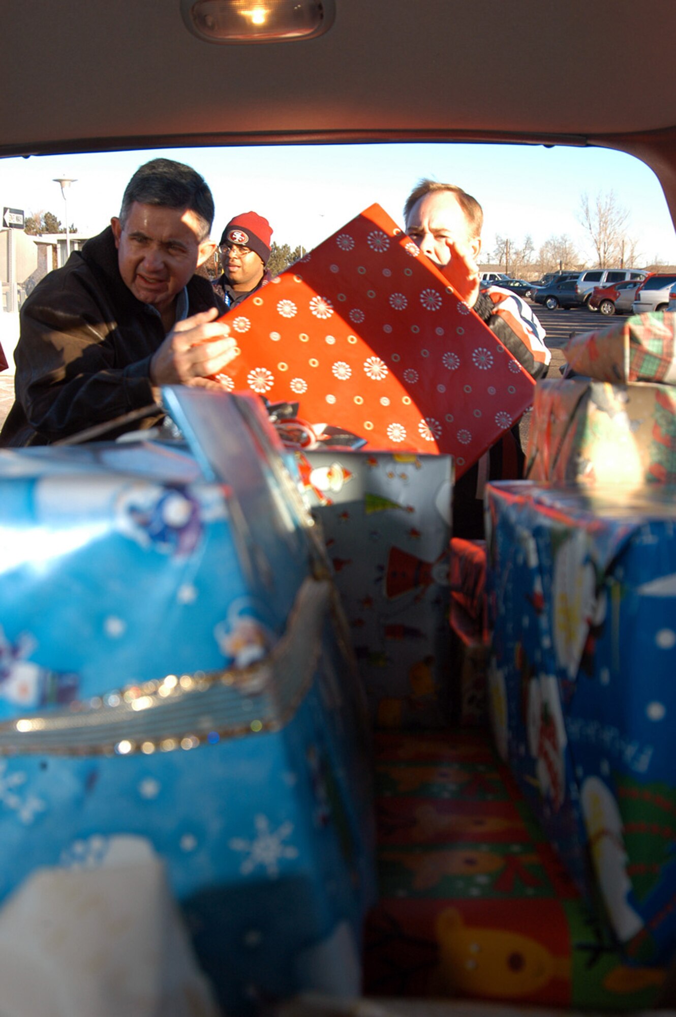 DENVER (AFPN) -- (From left) Master Sgts. Bryan Burgess, Damian Maddox and Laramie Reece, to be delivered to less fortunate families. The Top 3 Airmen are from the Air Reserve Personnel Center here. (U.S. Air Force photo by Tech. Sgt. Rob Mims)