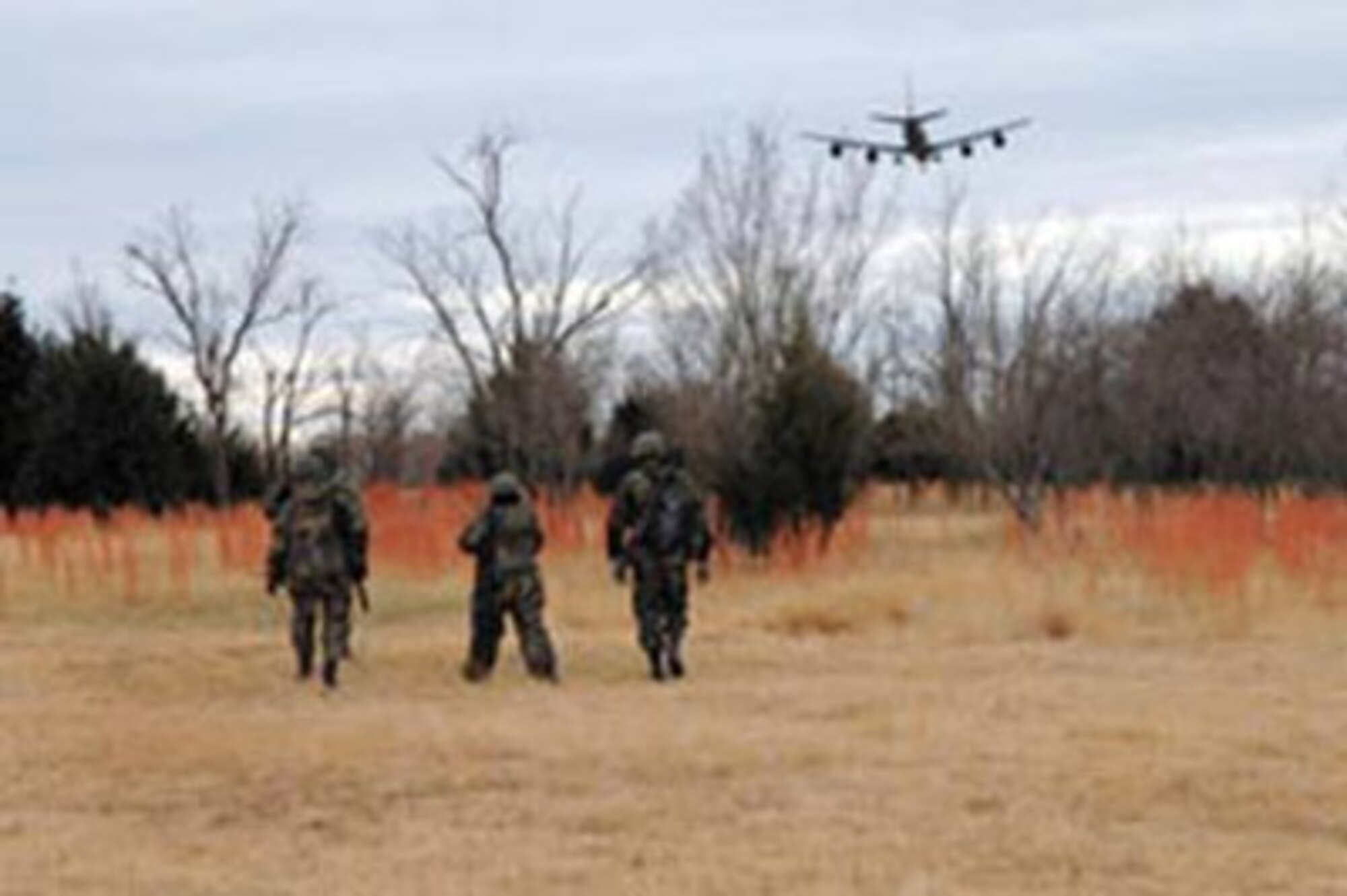 Airmen from the 72nd Air Base Wing make their way to one of the outdoor classrooms during the Expeditionary Combat Skills Training Course taught at the Glenwood training area north of Tinker Air Force Base. (Air Force photo by Darren D. Heusel)

