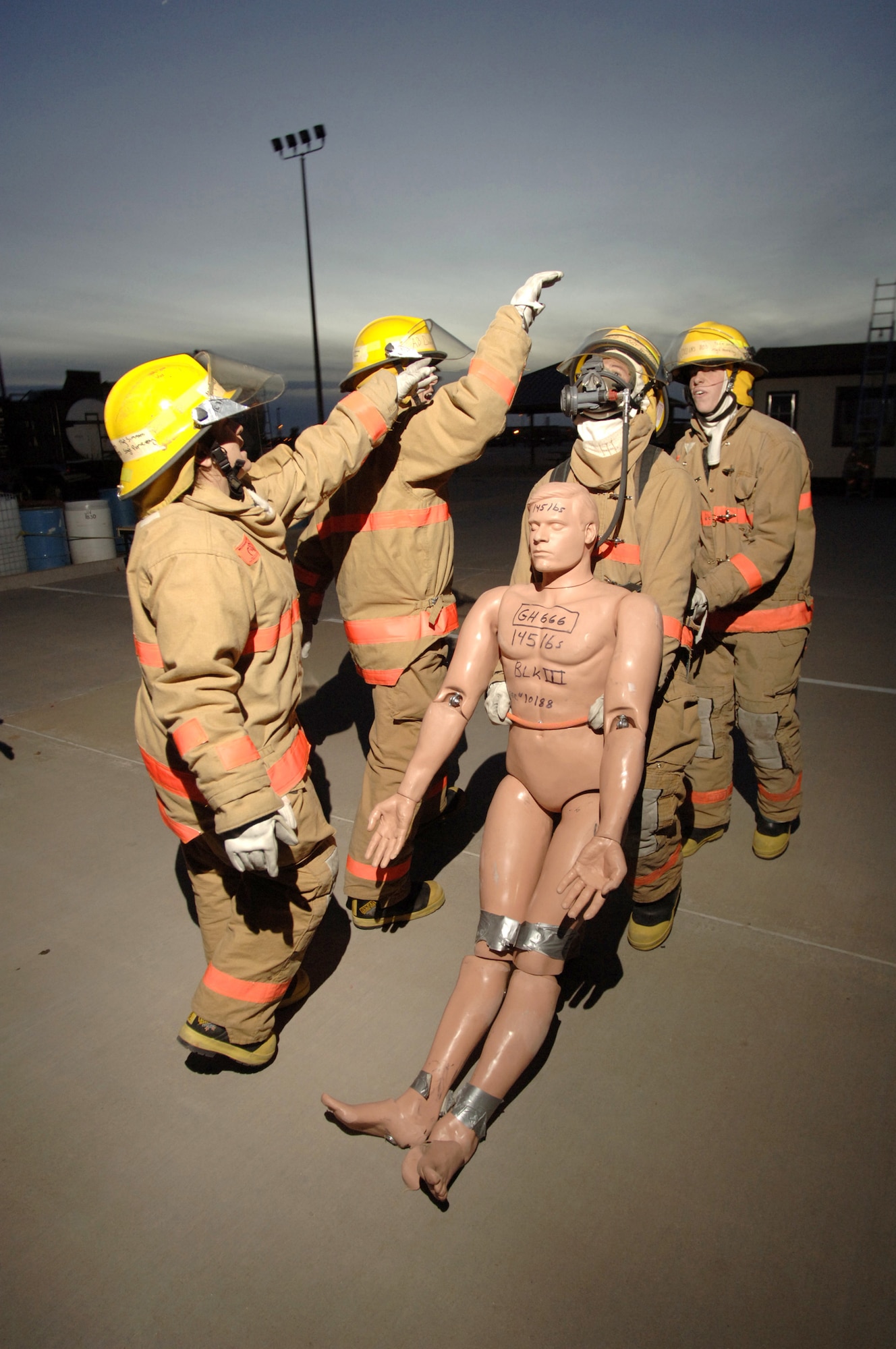 GOODFELLOW AIR FORCE BASE, Texas (AFPN) -- Airman Basic Tyler Wells drags a rescue dummy 100 feet as part of the fireman's physical training evaluation. The entire evaluation must be completed in eight minutes. (U.S. Air Force photo by Master Sgt. Lance Cheung)