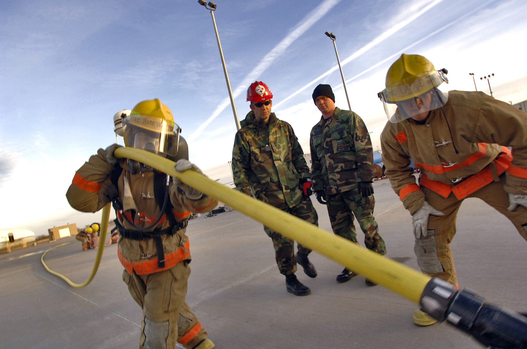 GOODFELLOW AIR FORCE BASE, Texas (AFPN) -- Airman 1st Class Jose Ruiz pulls a charged hose line as part of the fireman's physical training evaluation. The entire evaluation must be completed in eight minutes. Airman Ruiz is from Ramstein, Germany. (U.S. Air Force photo by Master Sgt. Lance Cheung)
