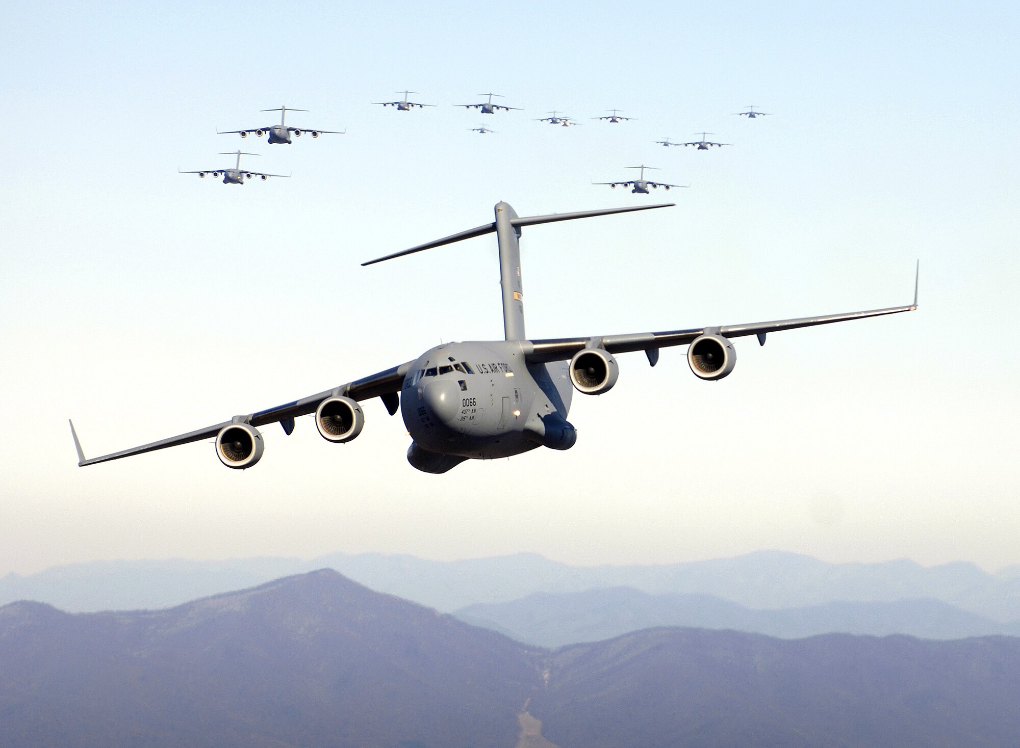 CHARLESTON, S.C. (AFPN) -- A formation of 17 C-17 Globemaster IIIs fly over the Blue Ridge Mountains in Virginia during low-level tactical training. The C-17s, assigned to the 437th and 315th Airlift Wings here, were part of the largest formation in history from a single base and demonstrated the strategic airdrop capability of the Air Force. (U.S. Air Force photo by Staff Sgt. Jacob Bailey)