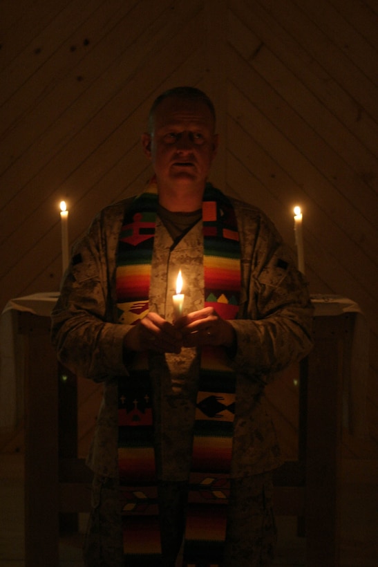 CAMP RIPPER,  Iraq ( December 24, 2005)- Regimental Chaplain, Lt. Cmdr. Bradley E. Tellen, 49, speaks during  a candle light vigil held at the chapel here. Tellen, a Jacksonville, N.C., native led the hour-long service held on Christmas Eve. (Official U.S. Marine Corps photo by Lance Cpl. Shane S. Keller 2d Marine Division Combat Camera)