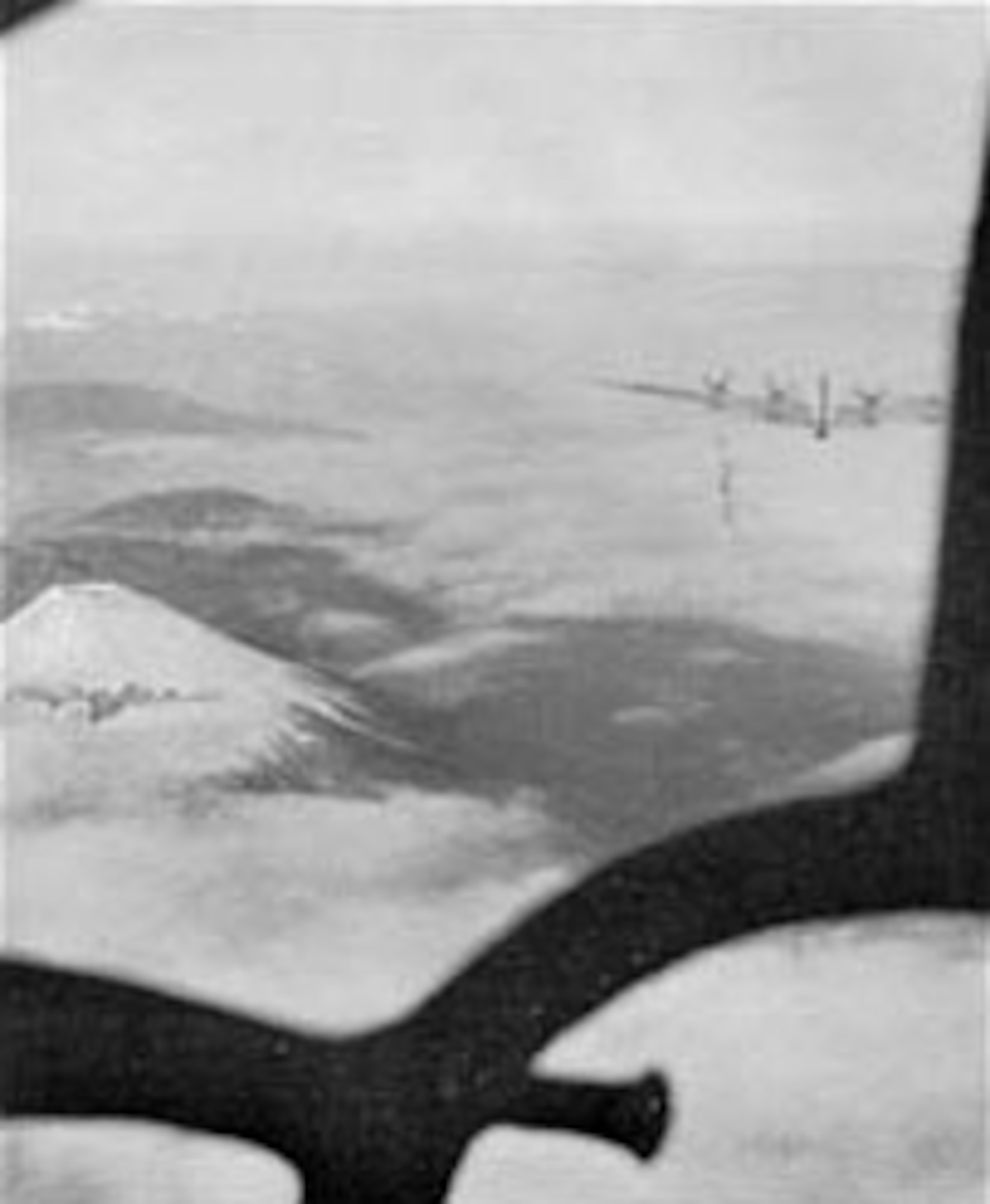 Mt. Fuji as seen through the nose of a B-29 over Japan on the first mission against Tokyo since the visit of General Doolittle's medium bombers in April 1942. Bombs were released over the primary target, the Musashino aircraft plant, on Nov. 24, 1944. (U.S. Air Force photo)