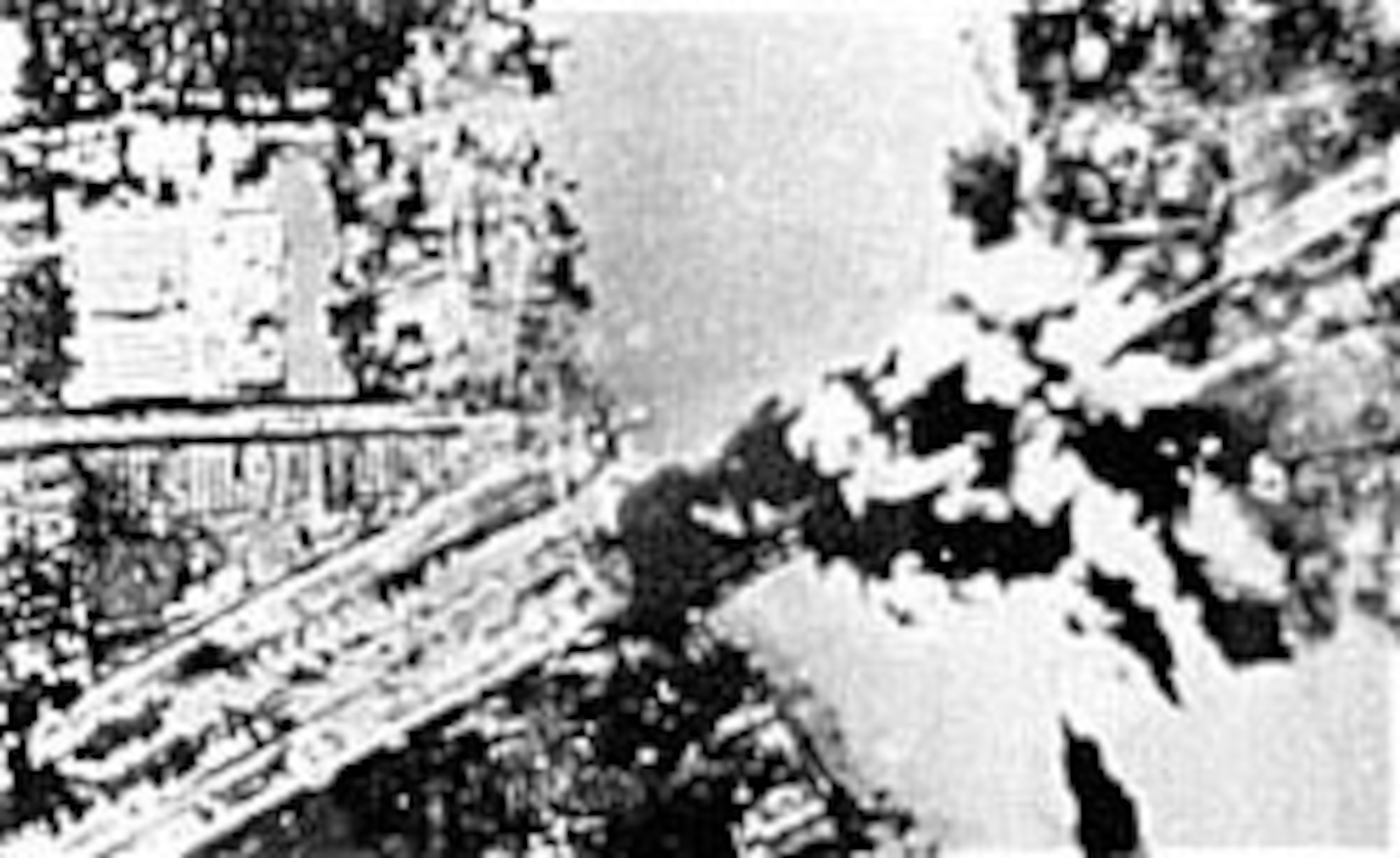 A salvo of bombs hits a bridge in Bangkok, Thailand. (U.S. Air Force photo)