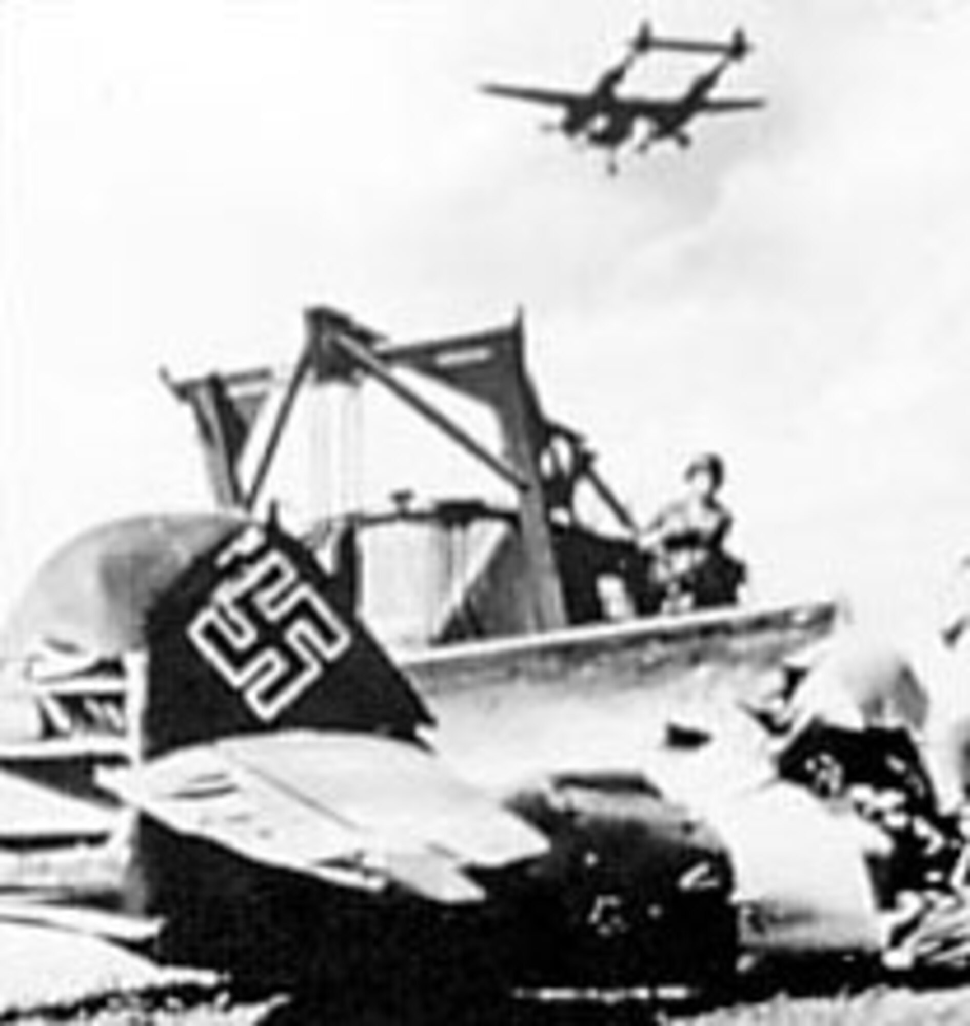 Symbolic of the Nazi defeat, an AAF fighter lands at a former Luftwaffe airfield as an Me-109 is pushed aside. (U.S. Air Force photo)