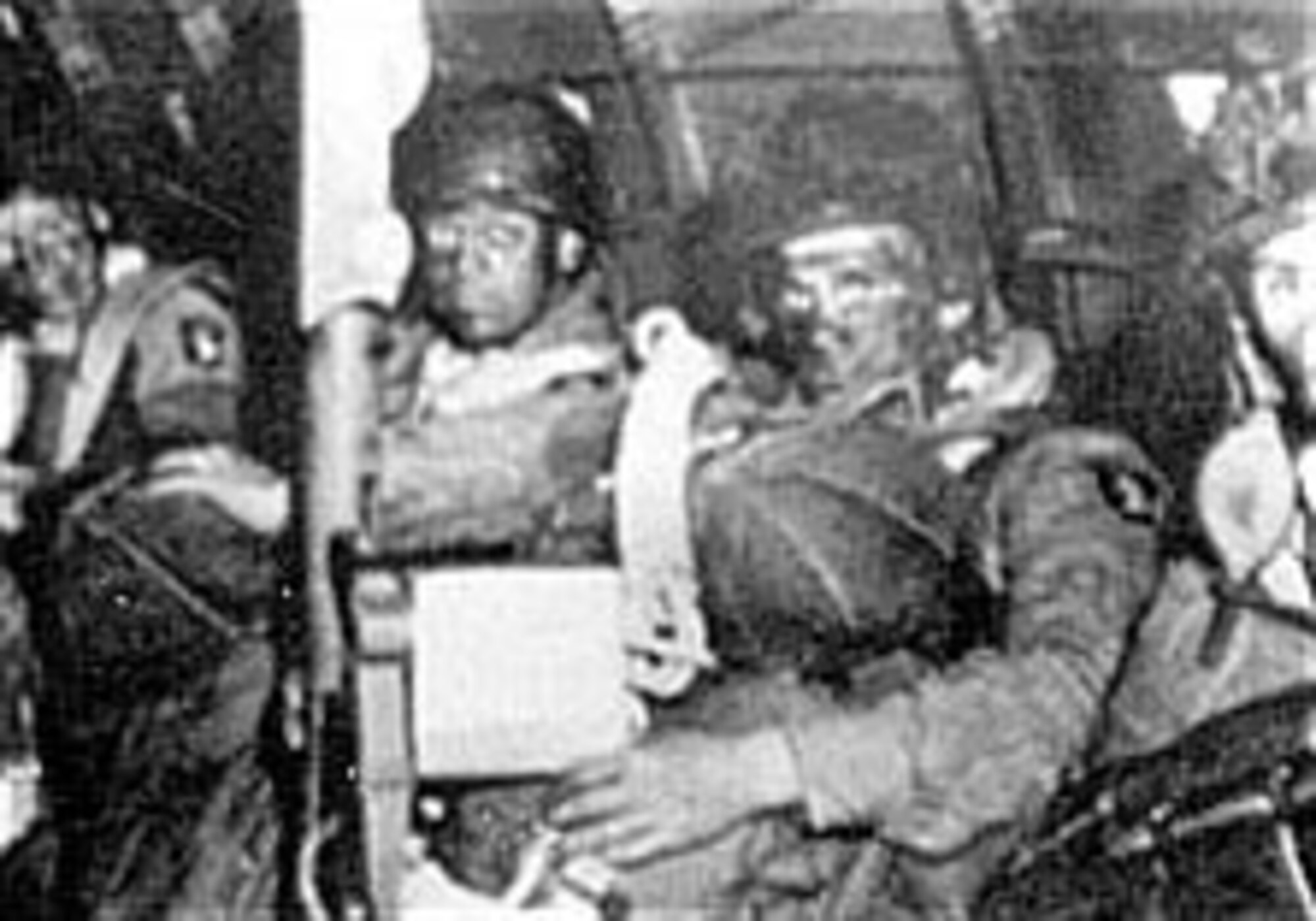 U.S. paratroopers, their faces blackened so they would be more difficult to see in the darkness, en route to their drop zone. (U.S. Air Force photo)