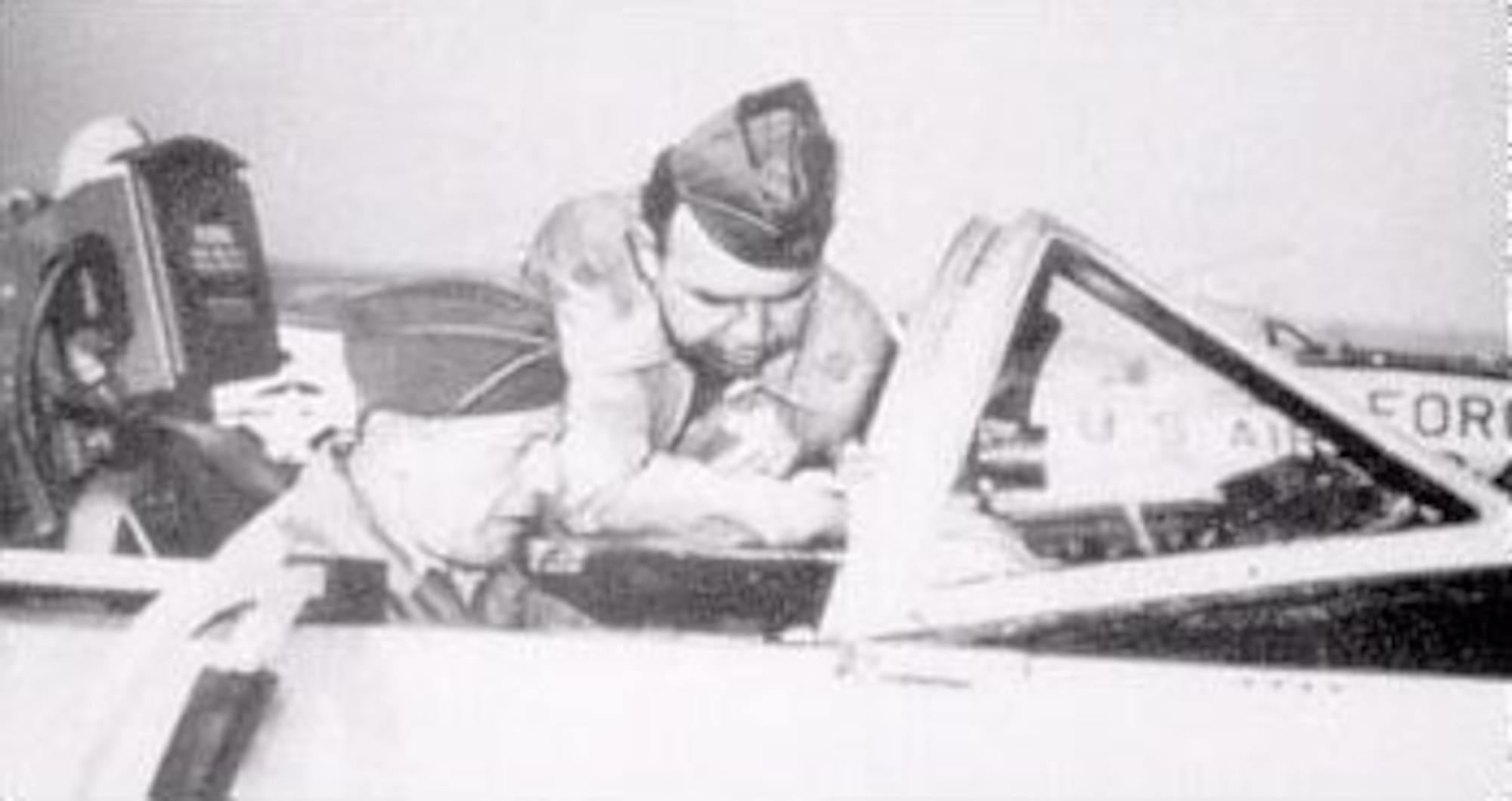 Col. Gene Raymond receives cockpit instructions in a T-33 jet trainer. He also flew the T-39, KC-97, KC-135 and C-141 before retiring. (U.S. Air Force photo)