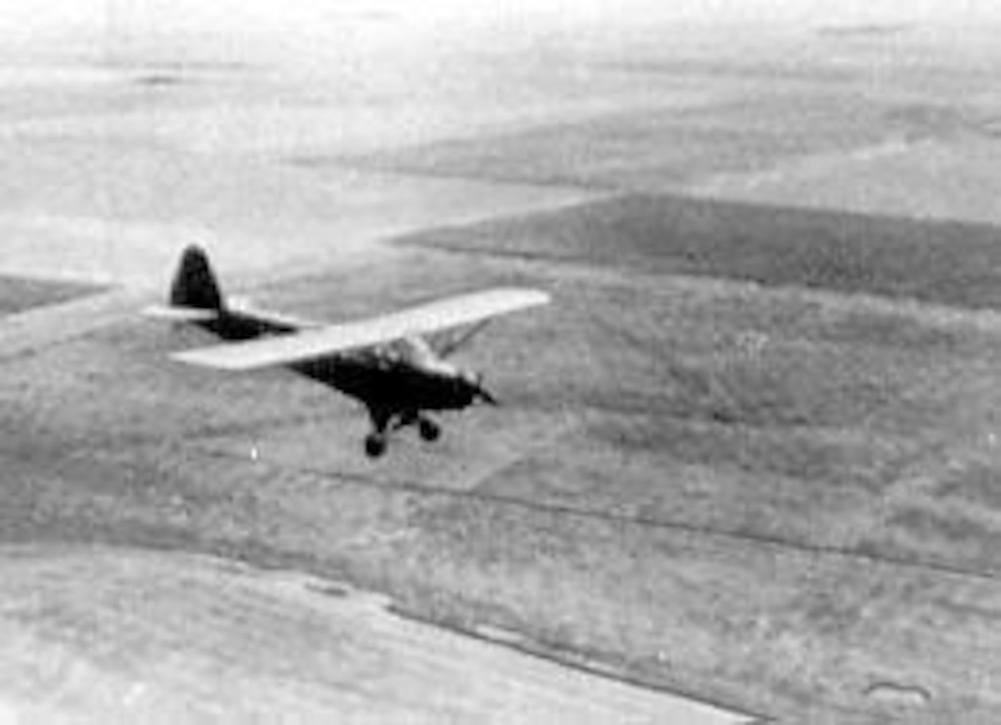 Student practicing glider landing in L-4 with engine stopped. (U.S. Air Force photo)